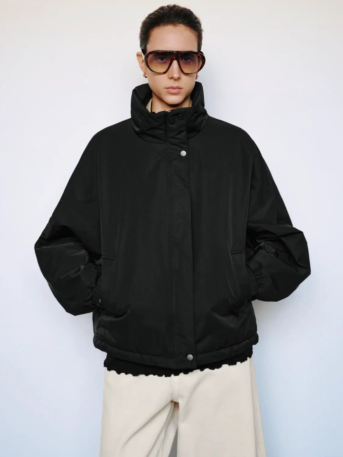Padded Jacket by Urban Revivo Fashion, black oversized silhouette with high collar and snap front.