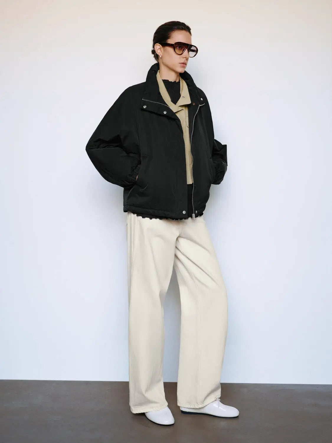 Padded Jacket black oversized by Urban Revivo Fashion; beige pants visible
