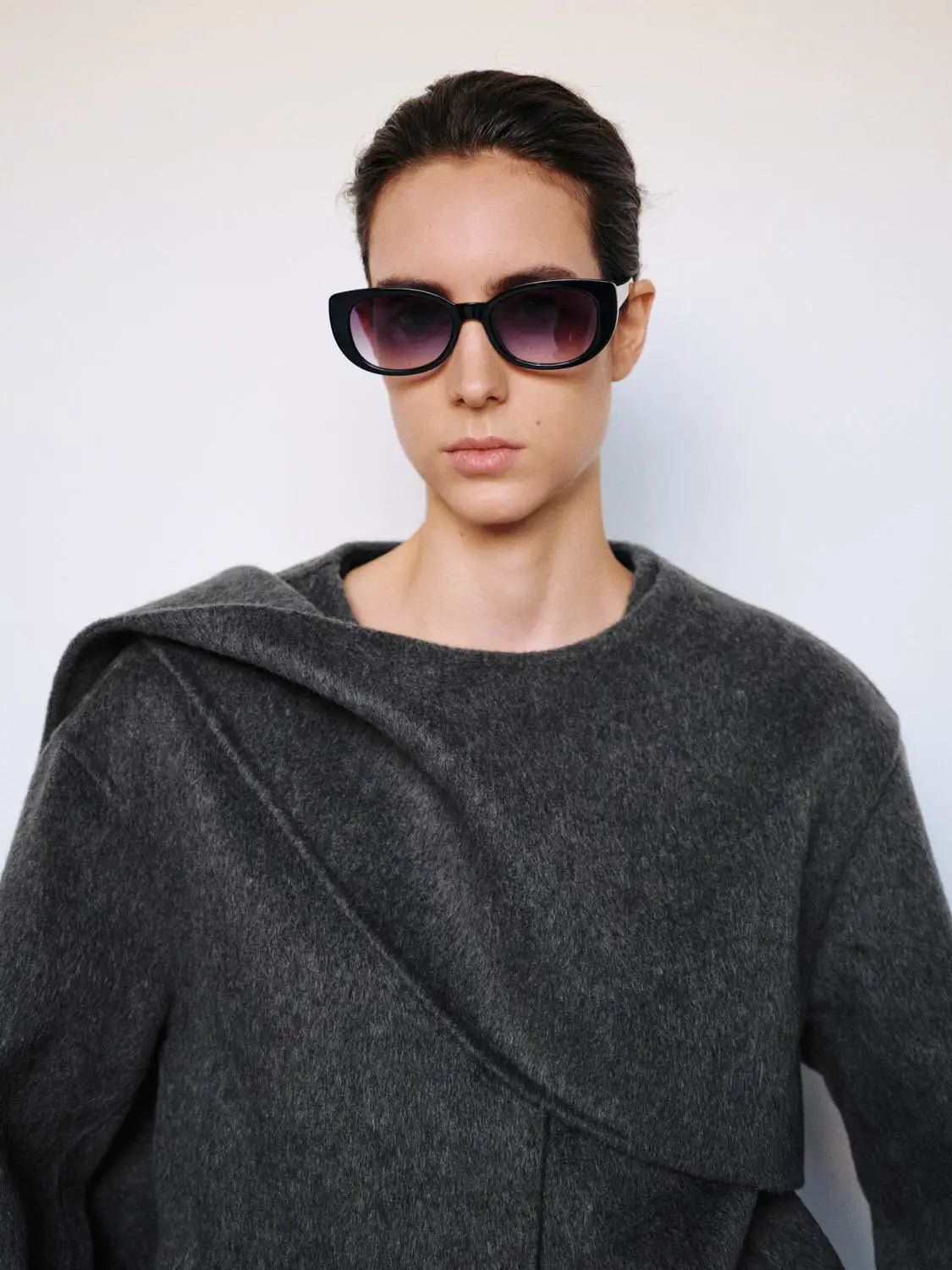Coat, dark gray wool blend with asymmetric wrap front.