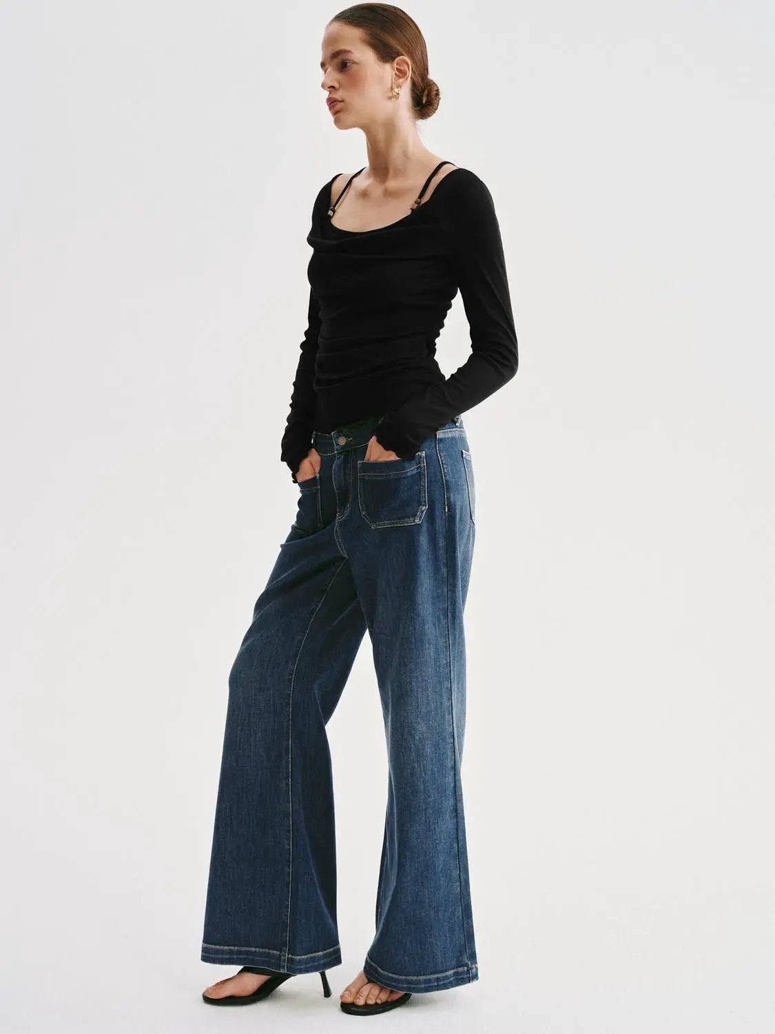 T-Shirt and jeans, 2-piece outfit: black ruched long-sleeve top paired with blue wide-leg denim.