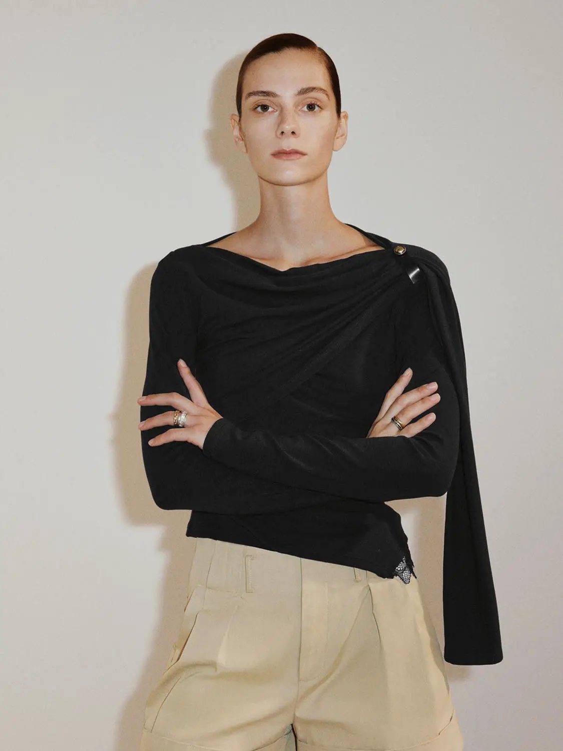 Draped One-Shoulder Long Sleeve Blouse in black with draped front and asymmetric neckline.