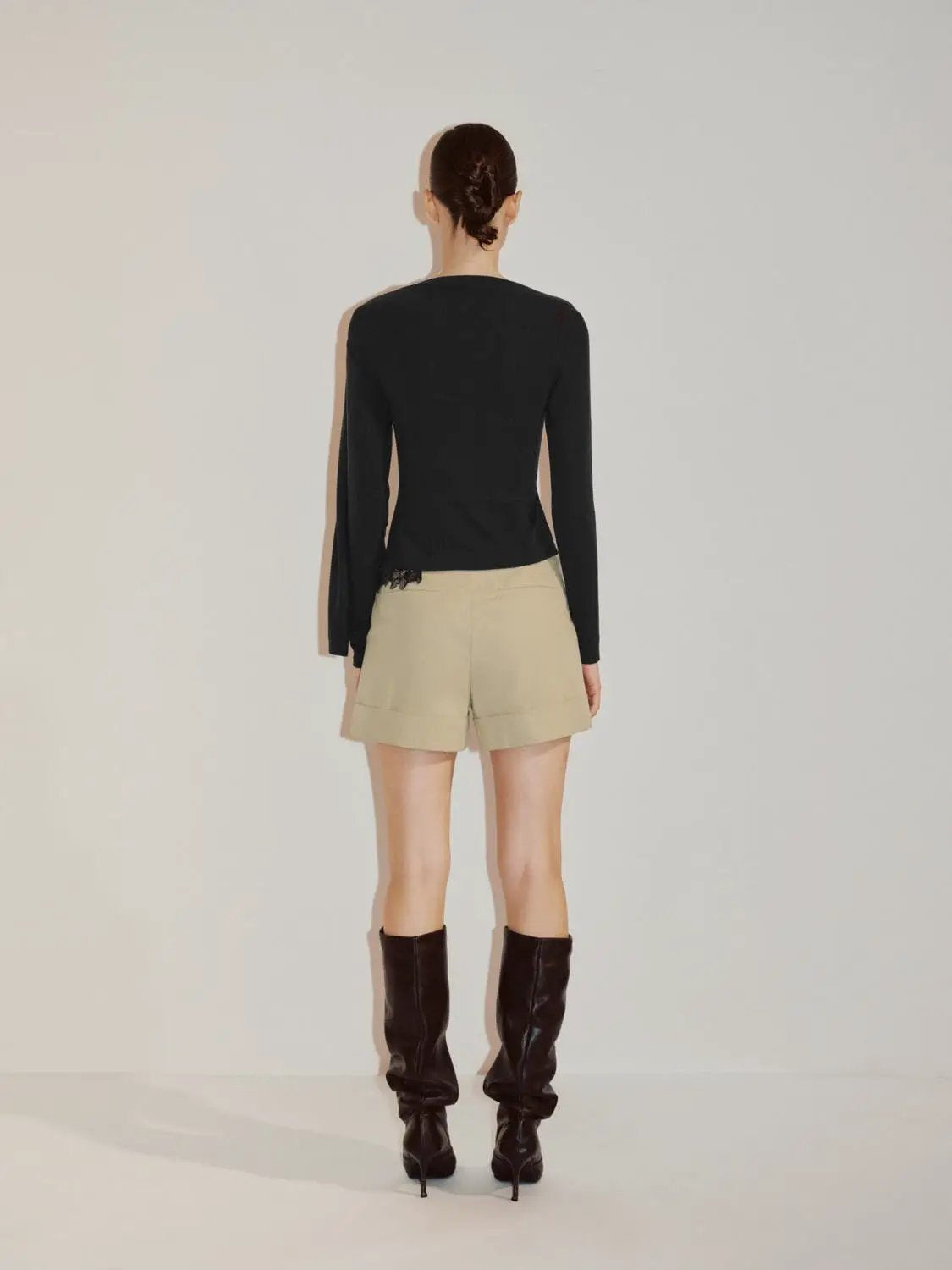 Draped One-Shoulder Long Sleeve Blouse in black with lace hem detail.