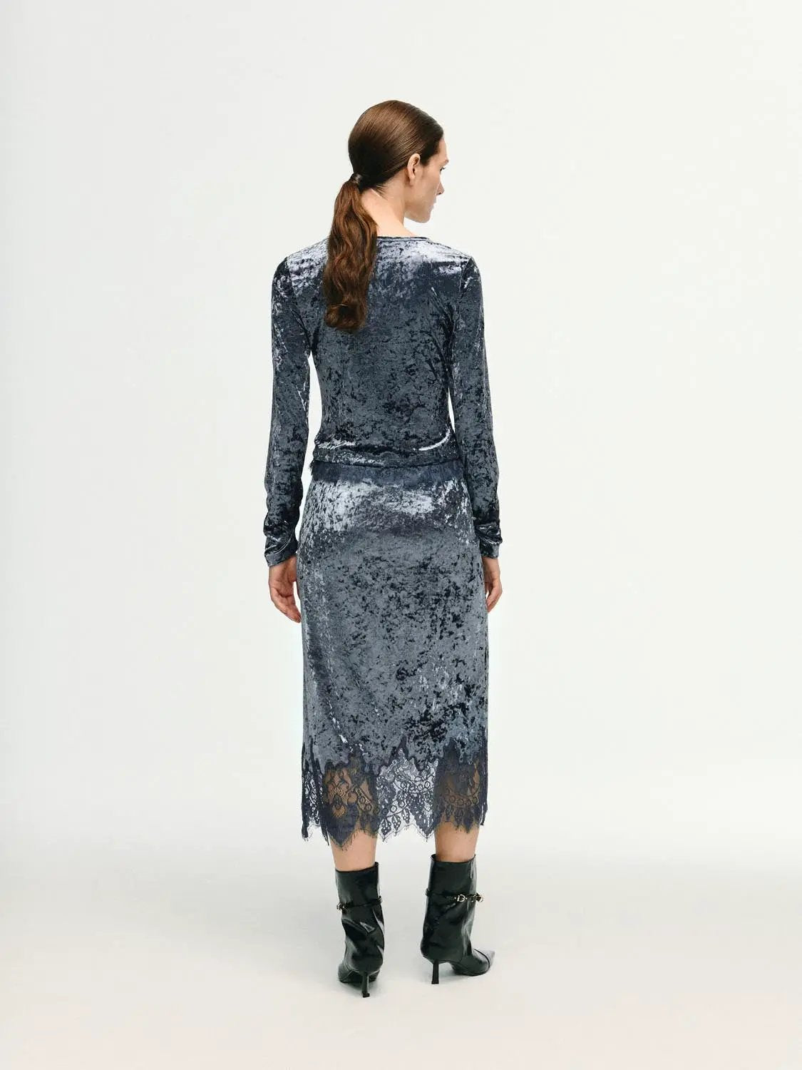 Scalloped lace-hem crushed-velvet H-line skirt in blue-gray, back view.