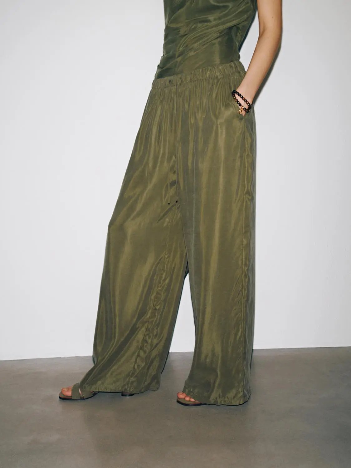 Drawstring Pull On Wide Leg Pants in olive green satin-like fabric; full-length, relaxed fit.