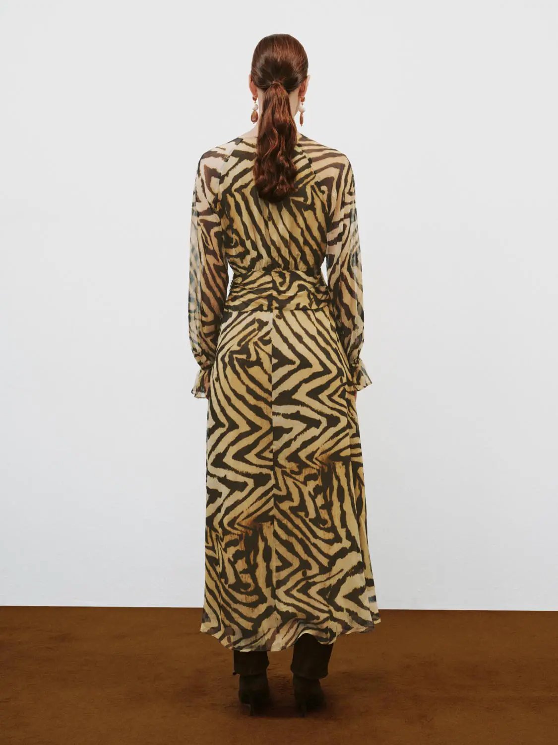 A-line dress by Urban Revivo Fashion in beige and black animal print, featuring long sleeves and a floor-length hem.