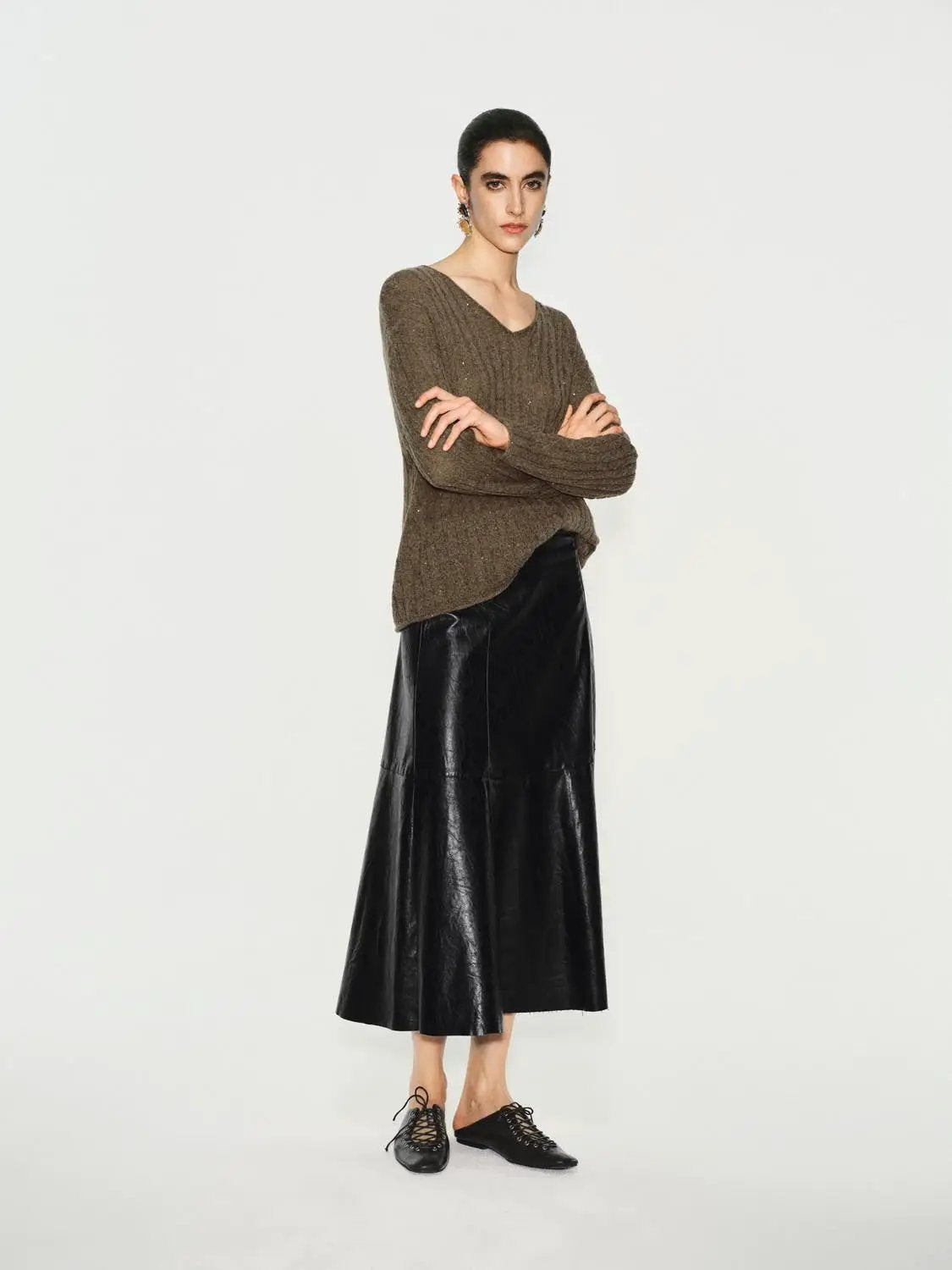 Textured long-sleeve V-neck knit T-shirt in brown by Urban Revivo Fashion, shown with a black leather maxi skirt