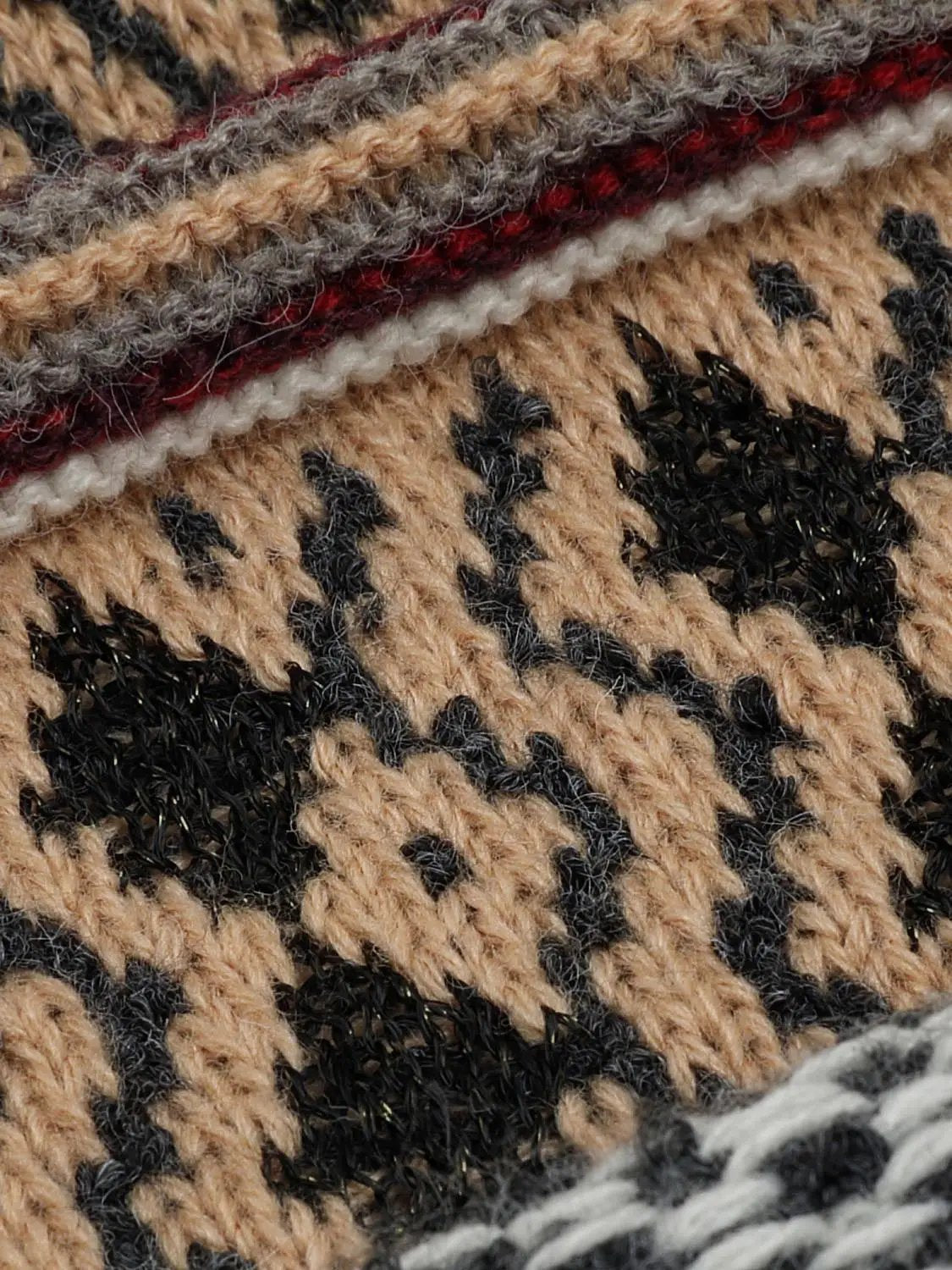 Knitwear jacket fabric in tan with black geometric pattern and maroon-gray-white striped accents