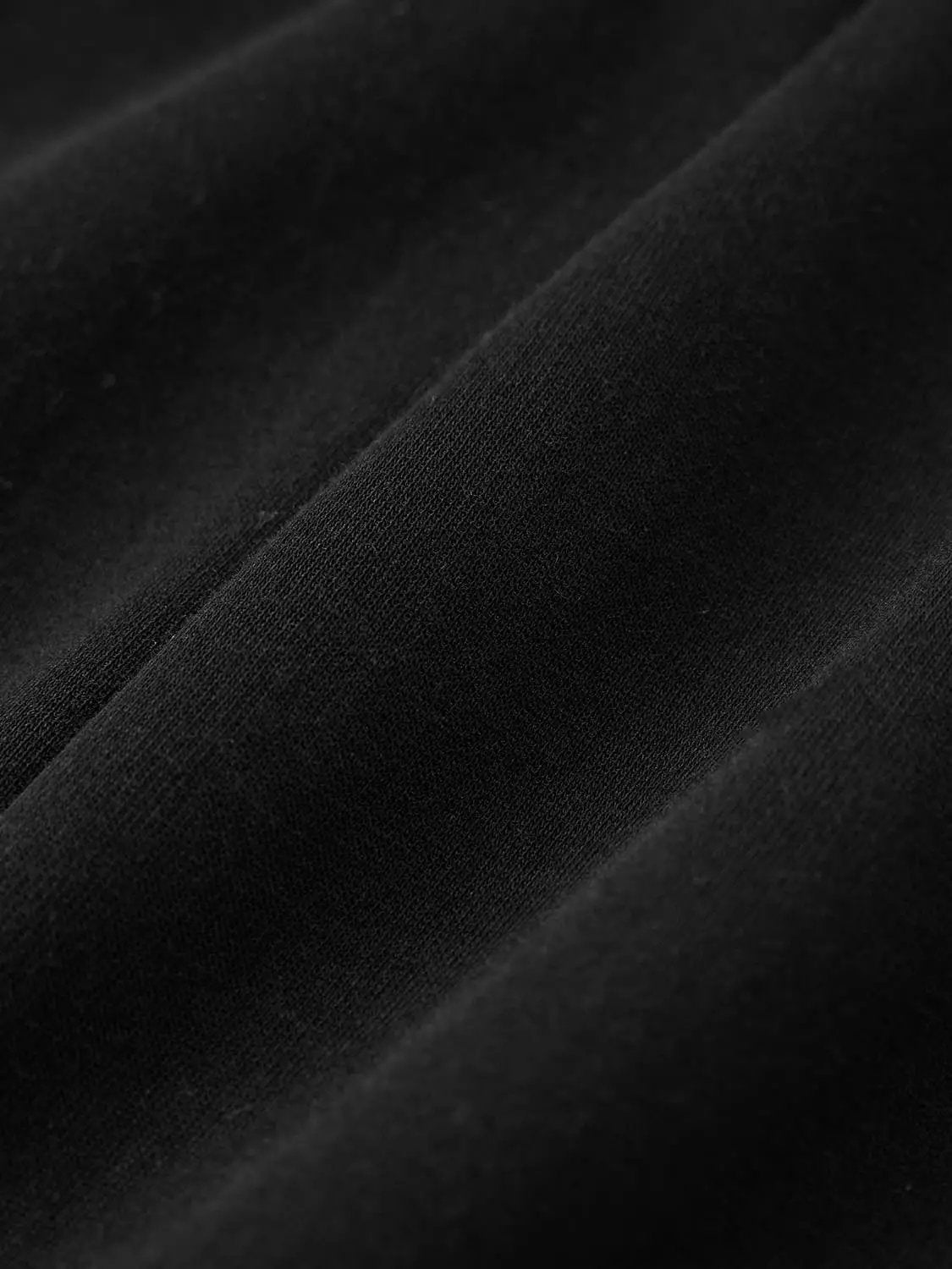V Neck Zip Front Fitted Waist Cropped Jacket in black knit fabric close-up