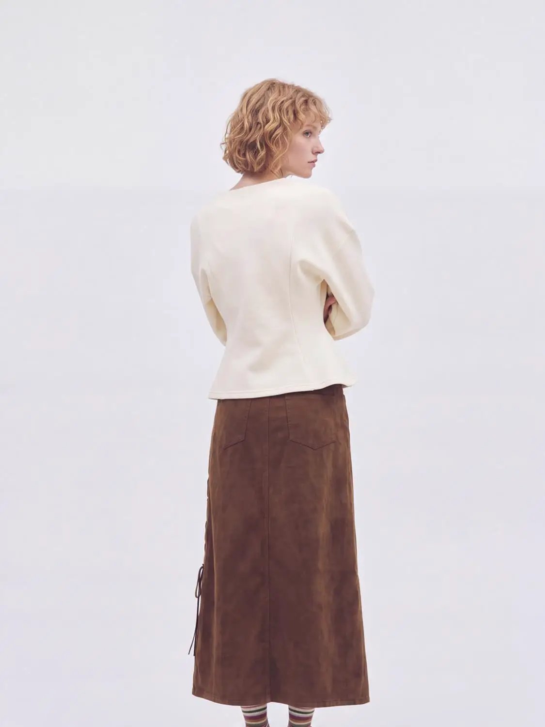 V-neck zip-front cropped jacket in cream with a fitted waist