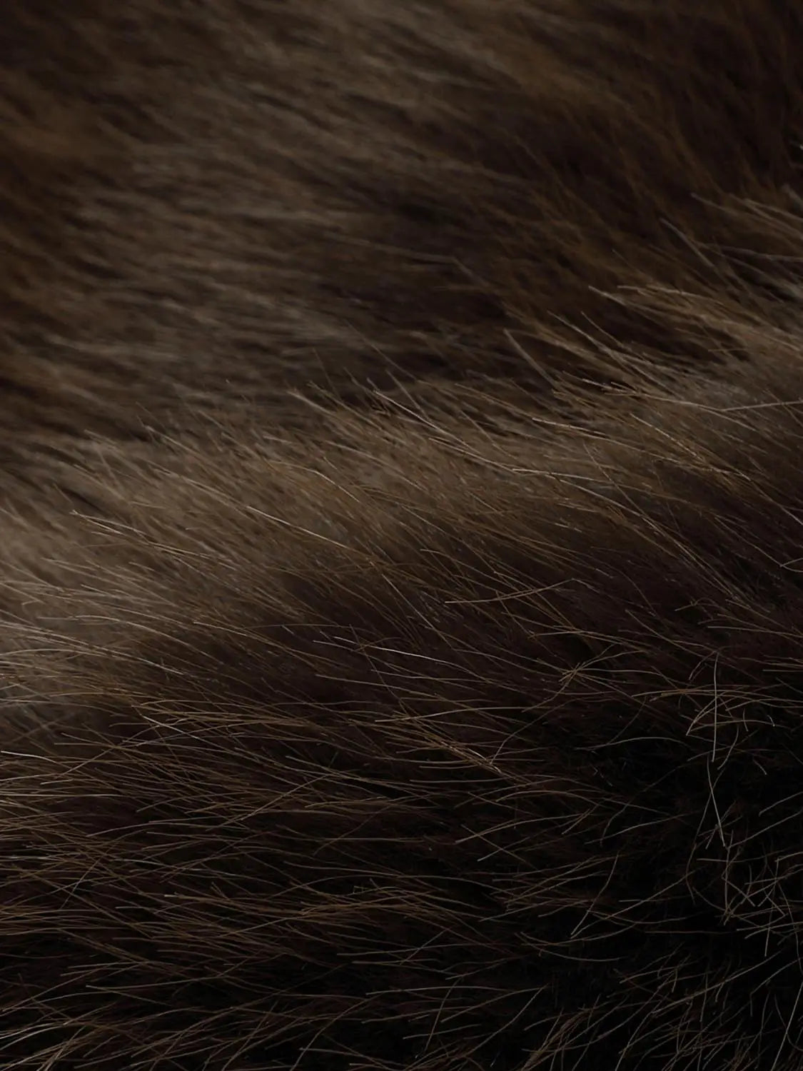 Faux fur texture close-up in rich brown tones; detailed, varied-length fibers for plush, realistic look.
