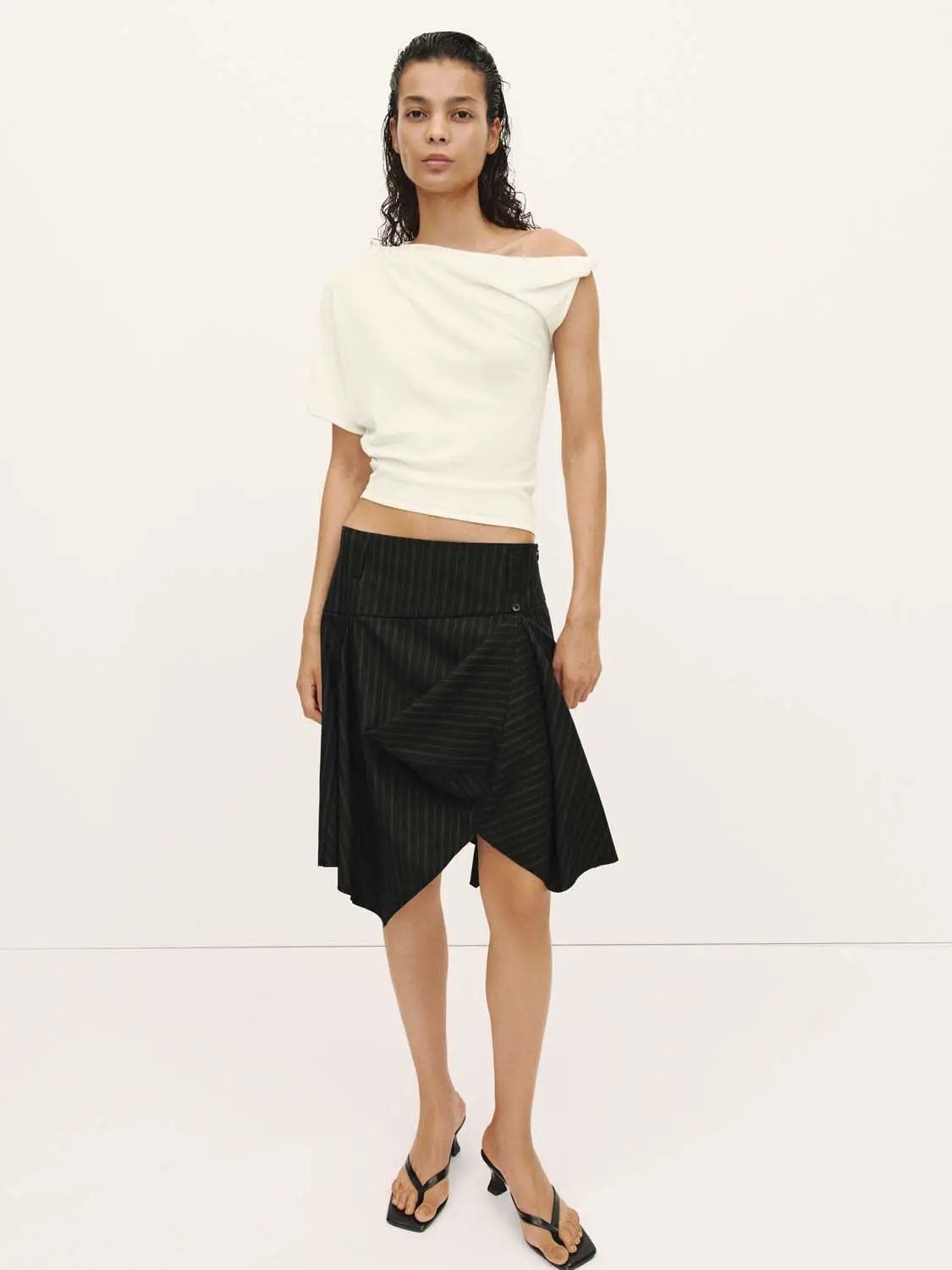 Pinstripe High-Waist Draped Asymmetric Wrap Midi Skirt, black with pinstripes.