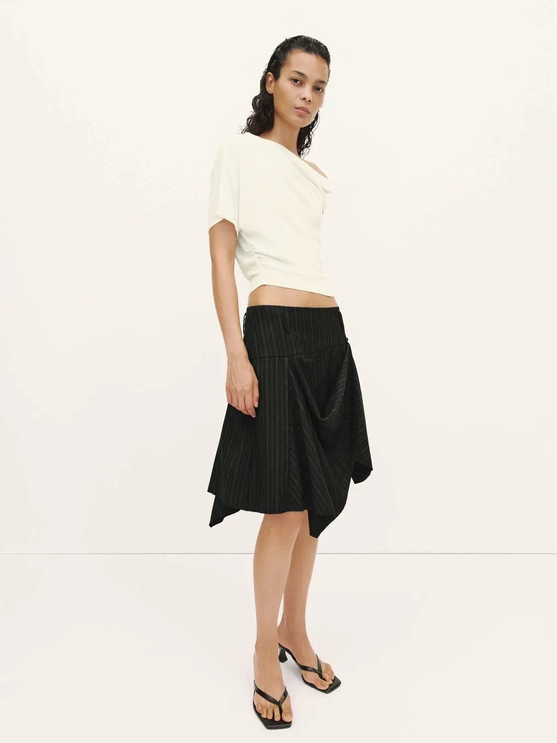 Pinstripe high-waist draped asymmetric wrap midi skirt in black with white pinstripes, Urban Revivo Fashion