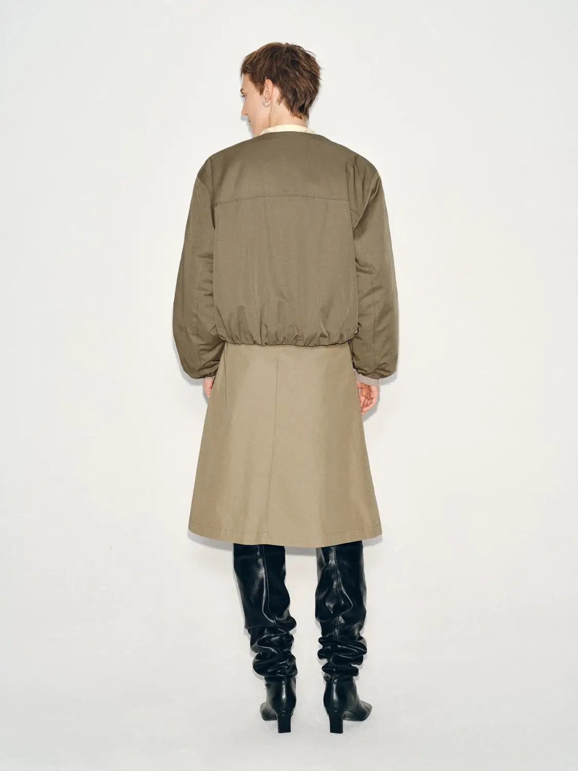 Pleated mid-rise belted A-line midi skirt in beige by Urban Revivo Fashion.