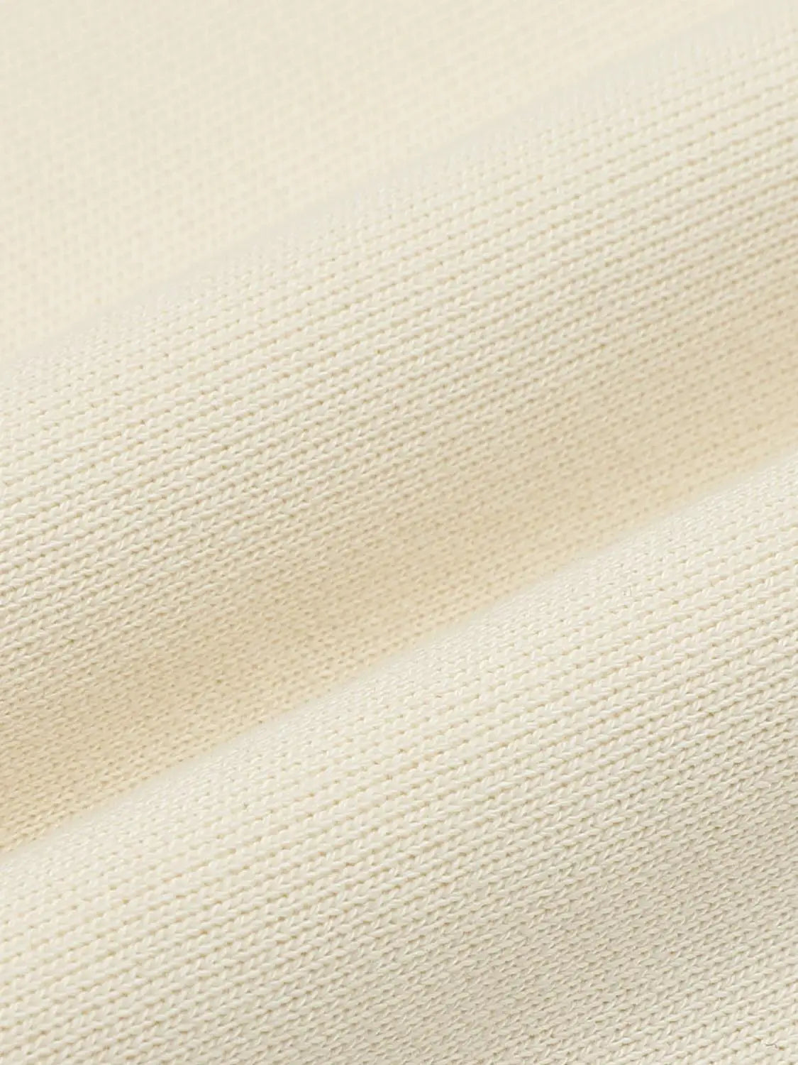 Wide-Leg Pants in creamy beige knit fabric, close-up texture.