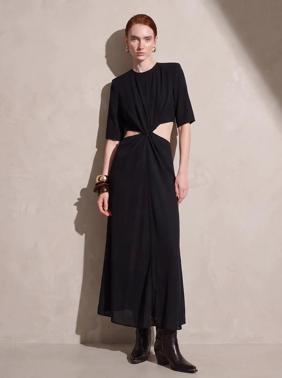 Round Neck Padded Shoulder Cutout Knotted Waist Midi Dress in black by Urban Revivo Fashion