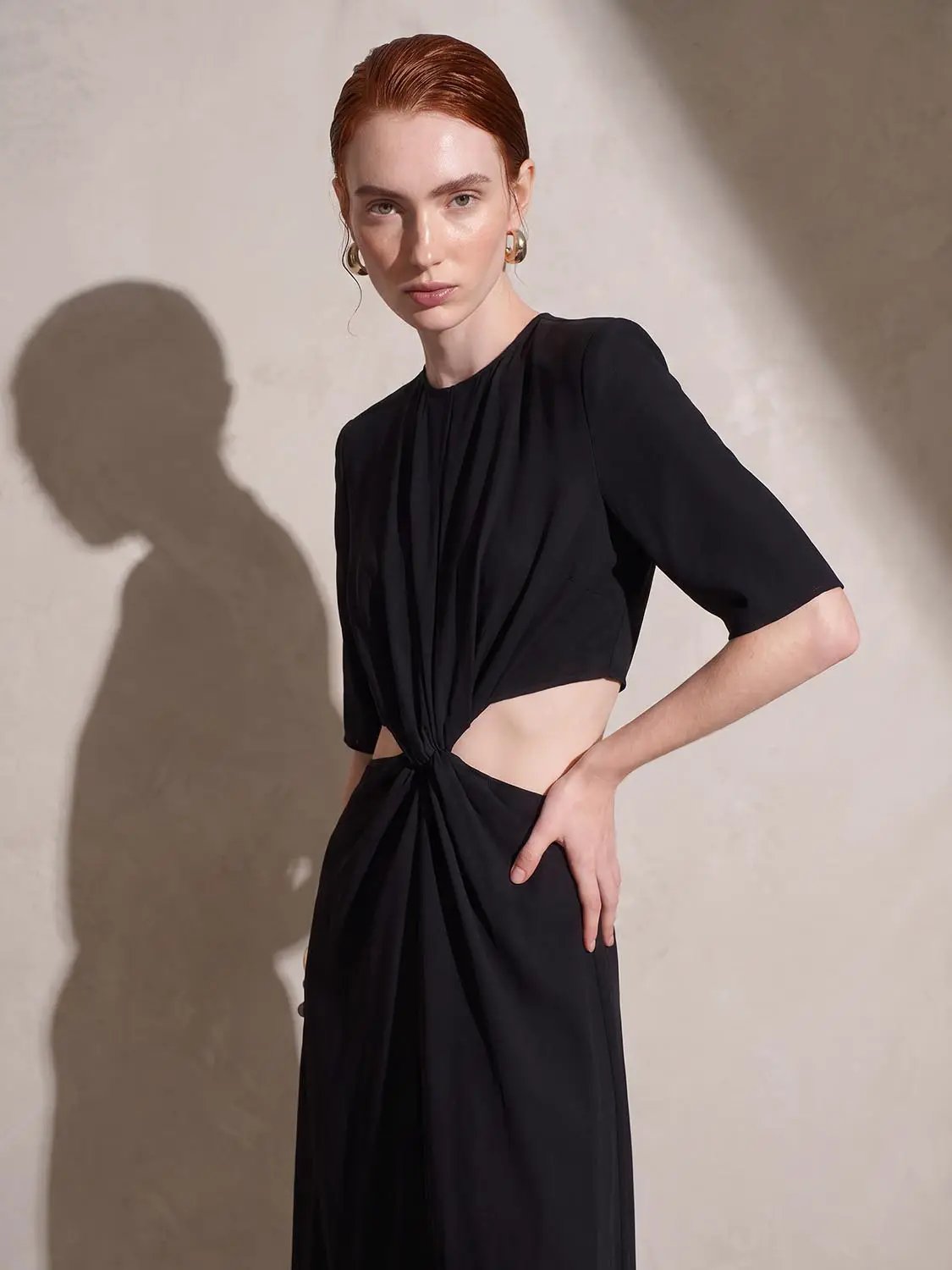 Round Neck Padded Shoulder Cutout Knotted Waist Midi Dress in black