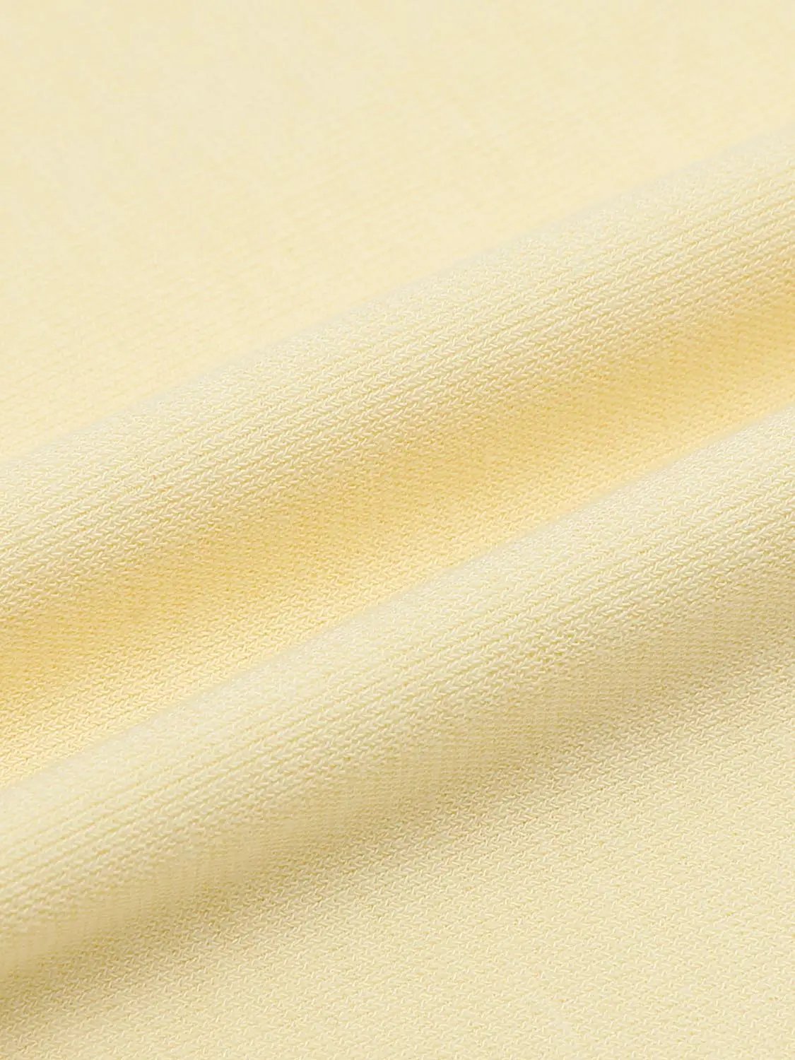 S-Line Dress close-up of pale yellow knit fabric with fine woven texture and soft finish for a refined look