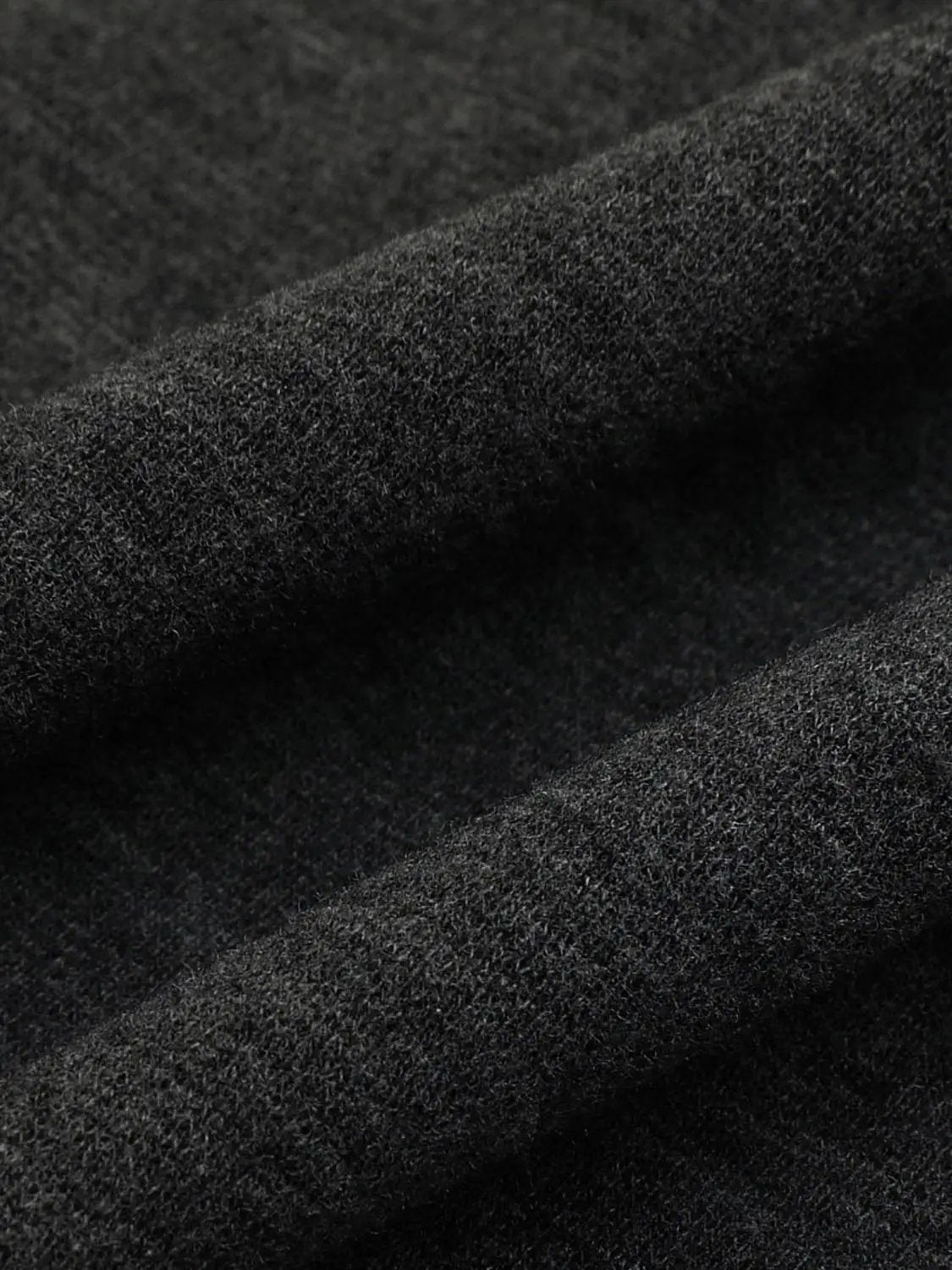 S-line Dress by Urban Revivo Fashion, black textured fabric close-up