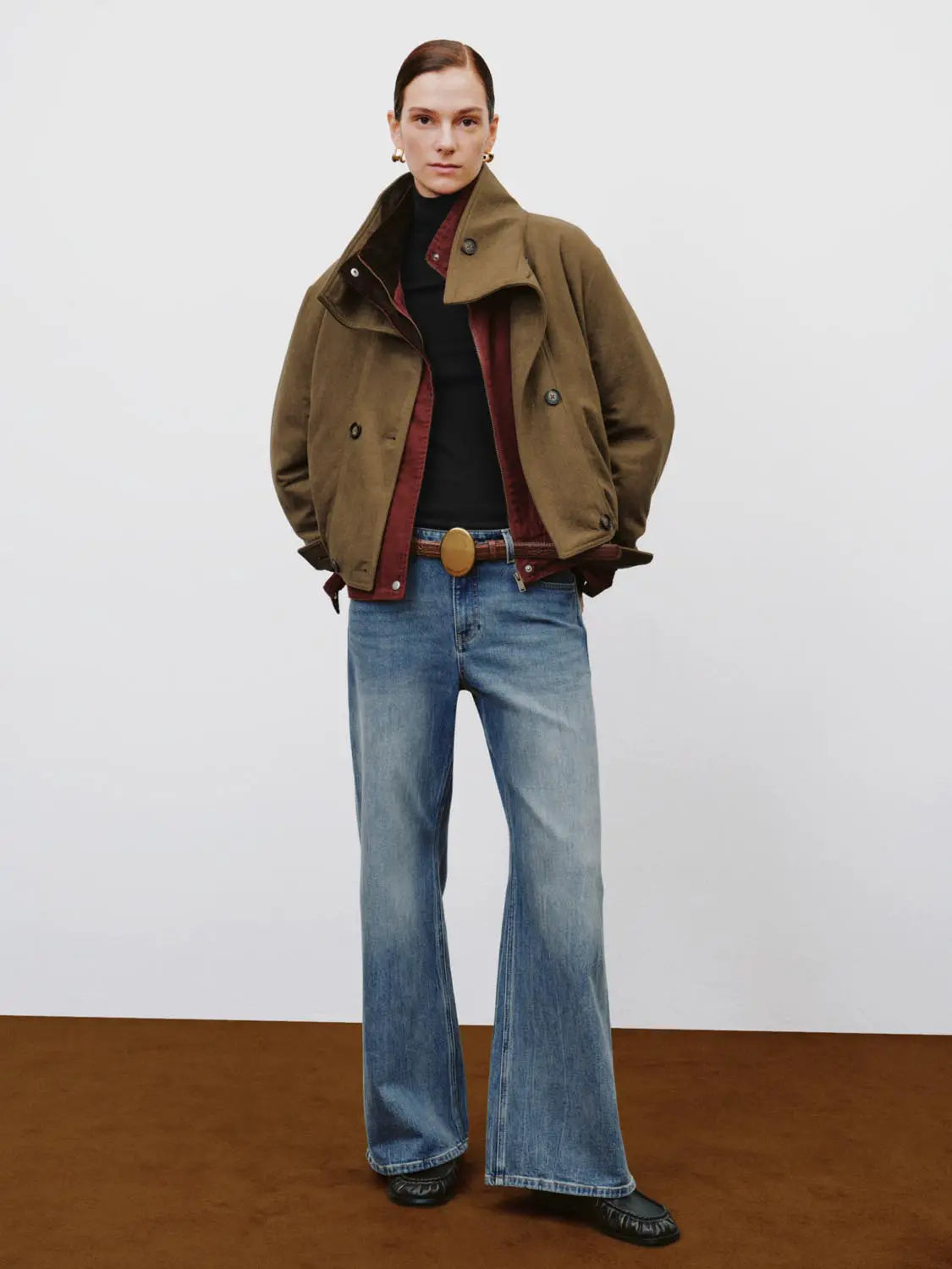 Jeans by Urban Revivo Fashion; light-wash wide-leg denim on model with brown belt.