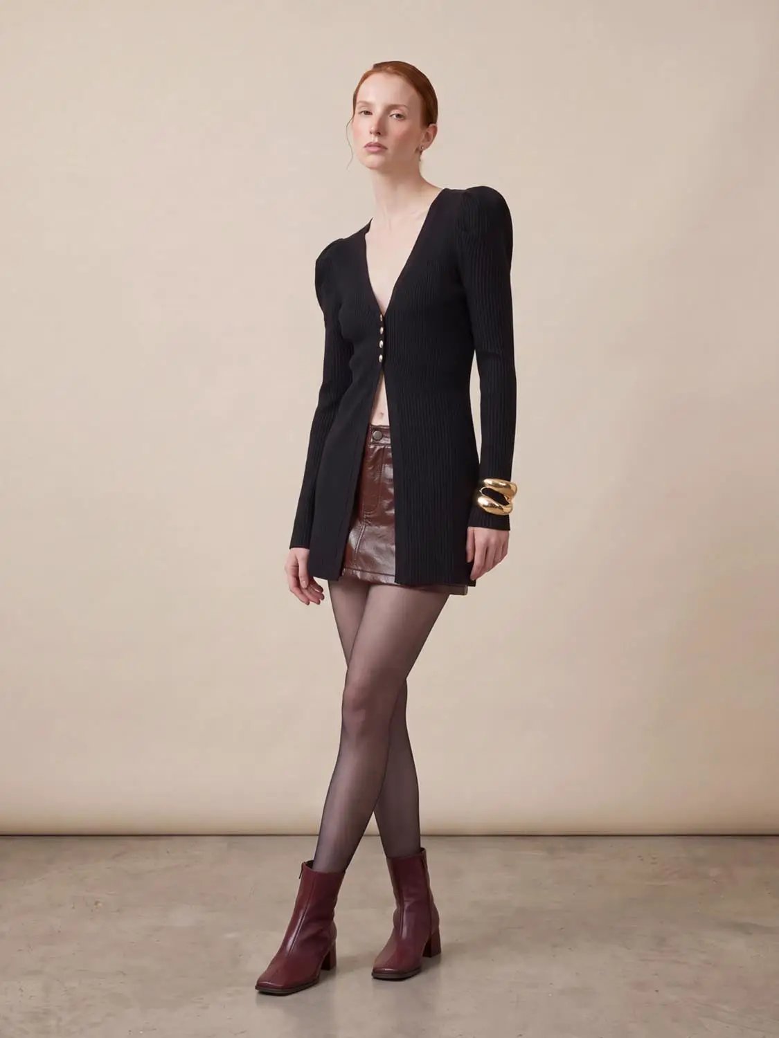 Puff Shoulder Tailored Knitted Cardigan, black ribbed knit with deep V-neck and gold front buttons.