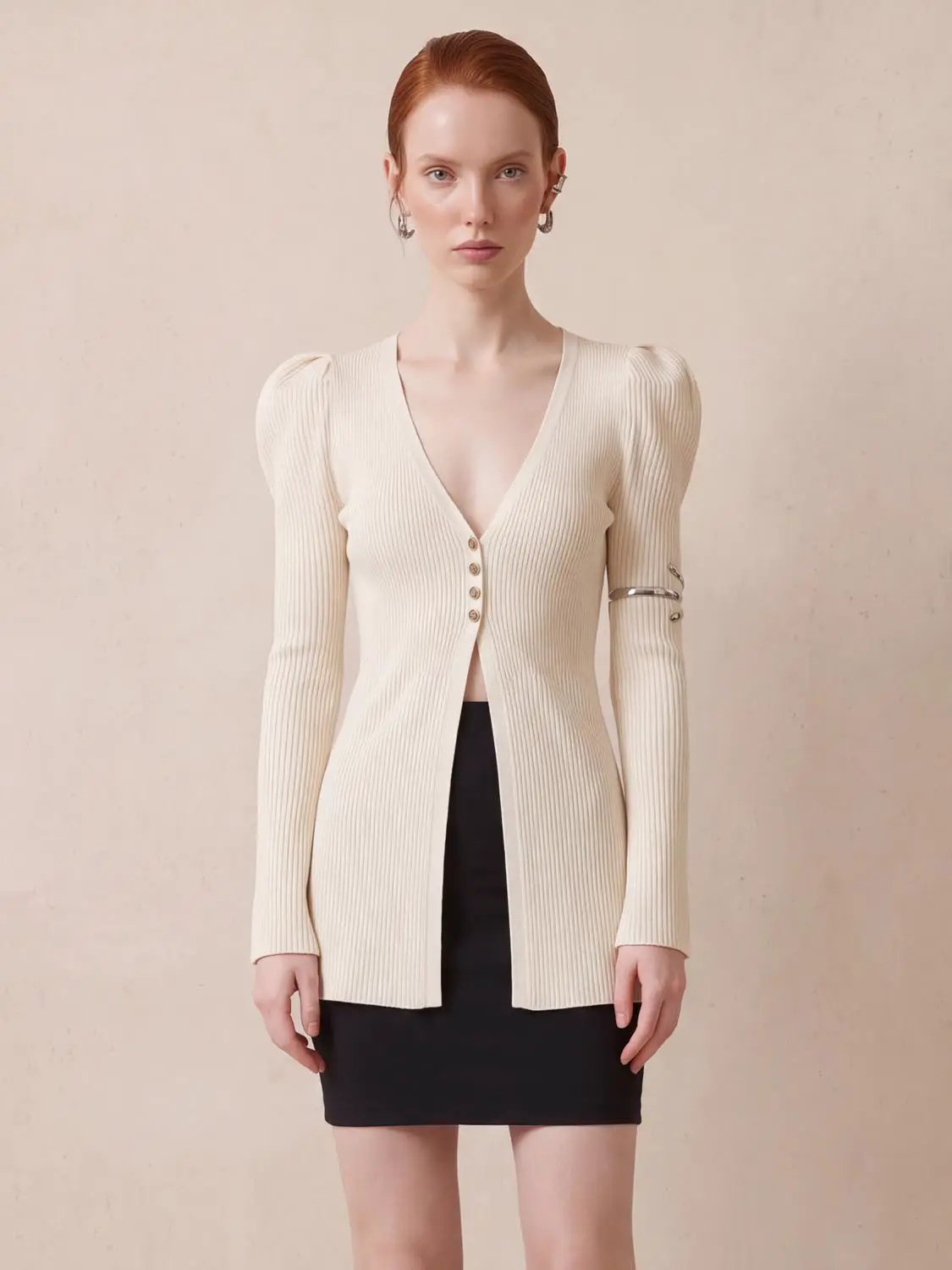 Puff Shoulder Tailored Knitted Cardigan in cream ribbed knit, long sleeves, V-neck with button front.