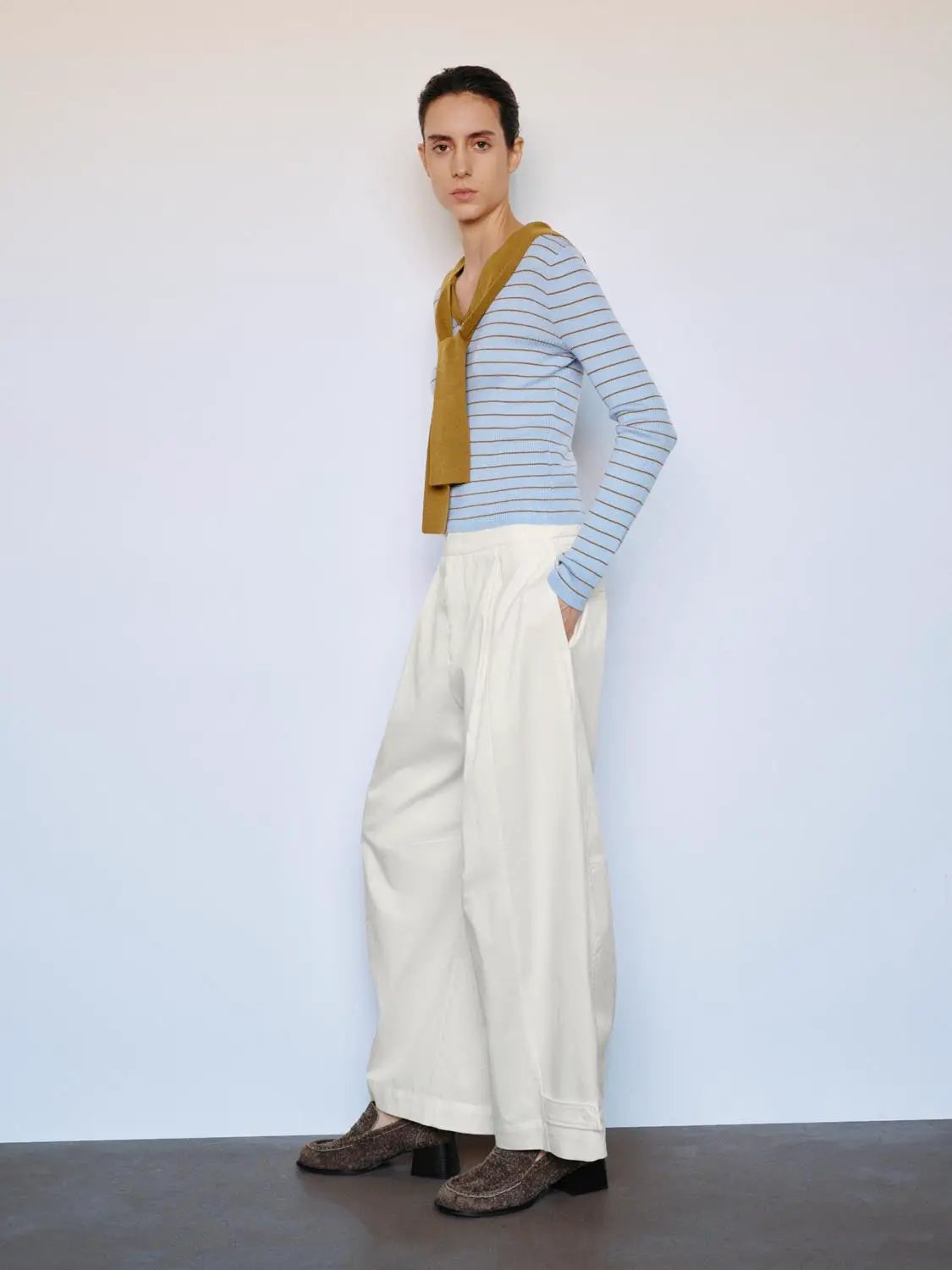 Striped knit T-shirt with V-neck and mustard shawl detail; light blue stripes.