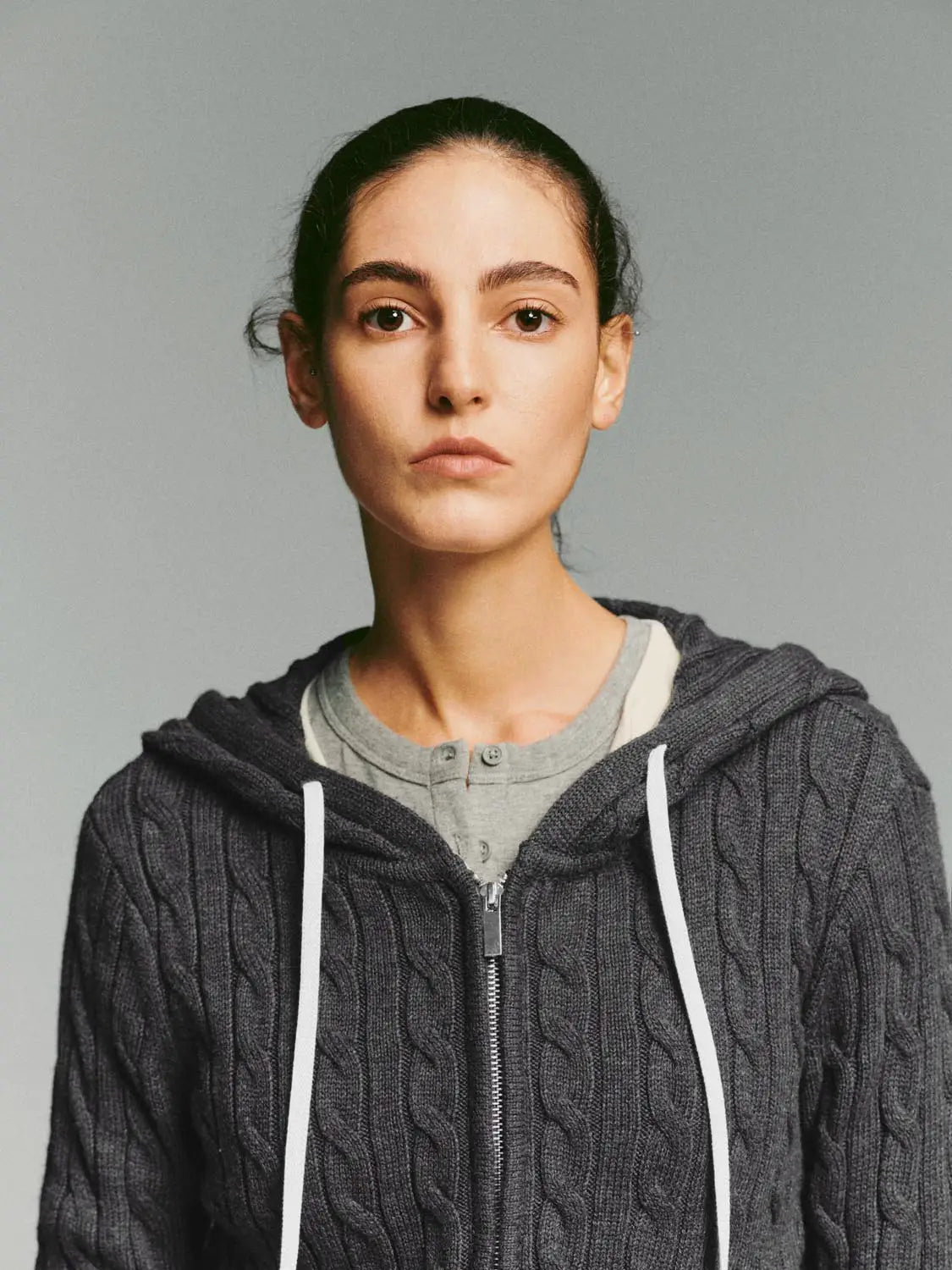 Knit Jacket, dark gray cable-knit cardigan with front zipper and white drawstrings.