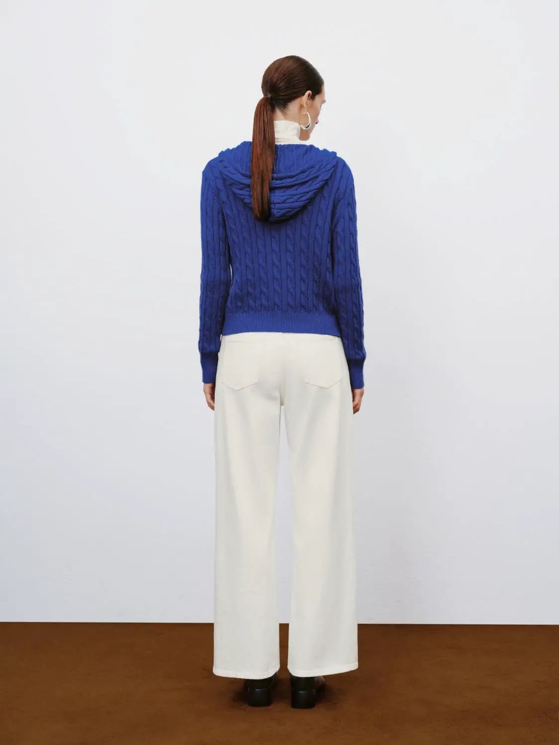 Cable-knit zip-front hoodie cardigan in blue; cotton-wool blend, long sleeves.