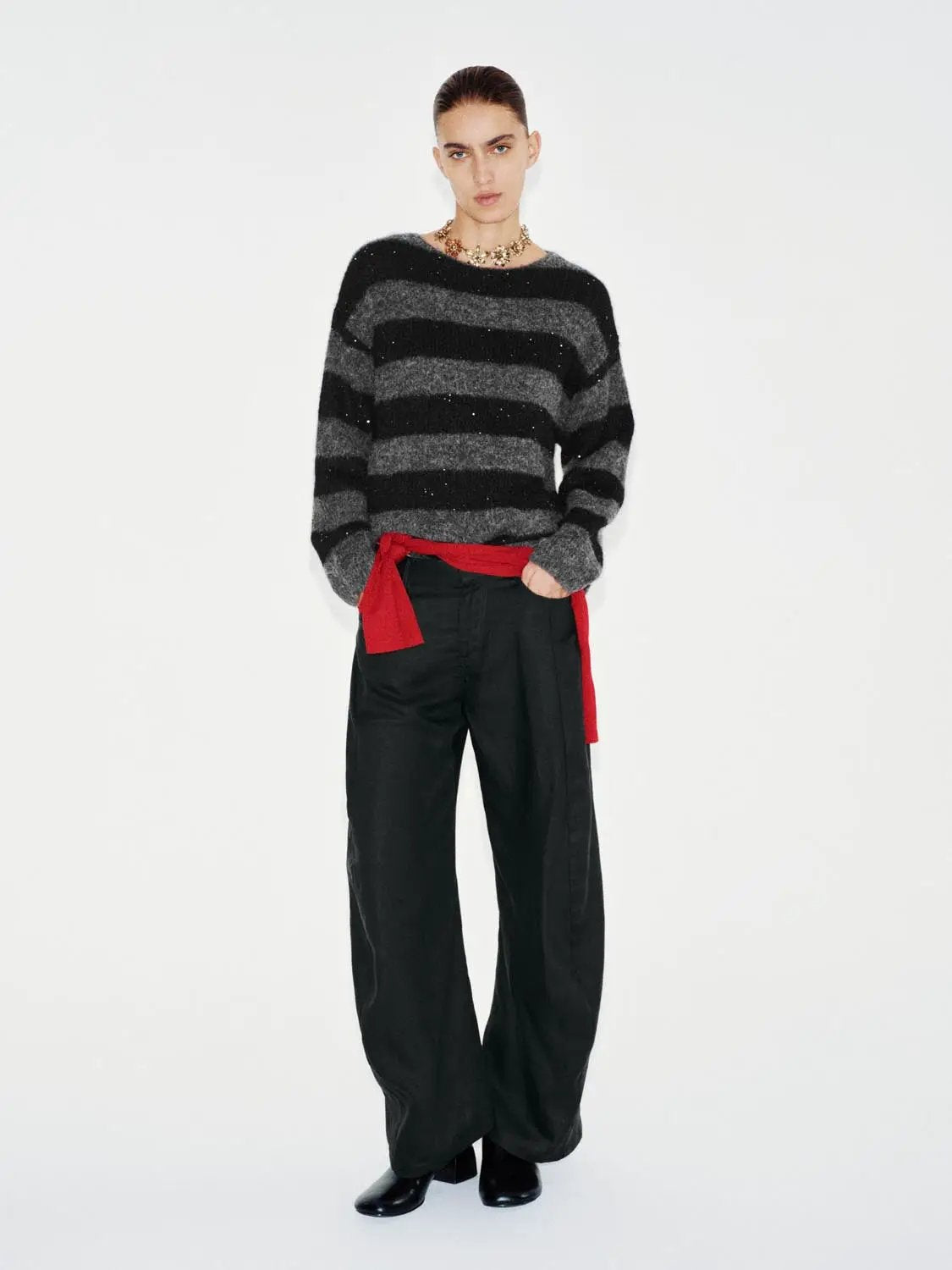 Textured Striped Oversized Boat Neck Long Sleeve Sweater in black and gray knit.