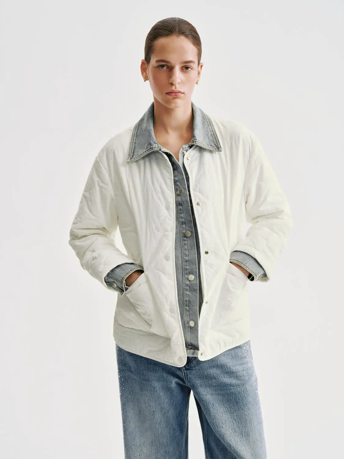 Padded jacket in cream with denim collar and cuffs.