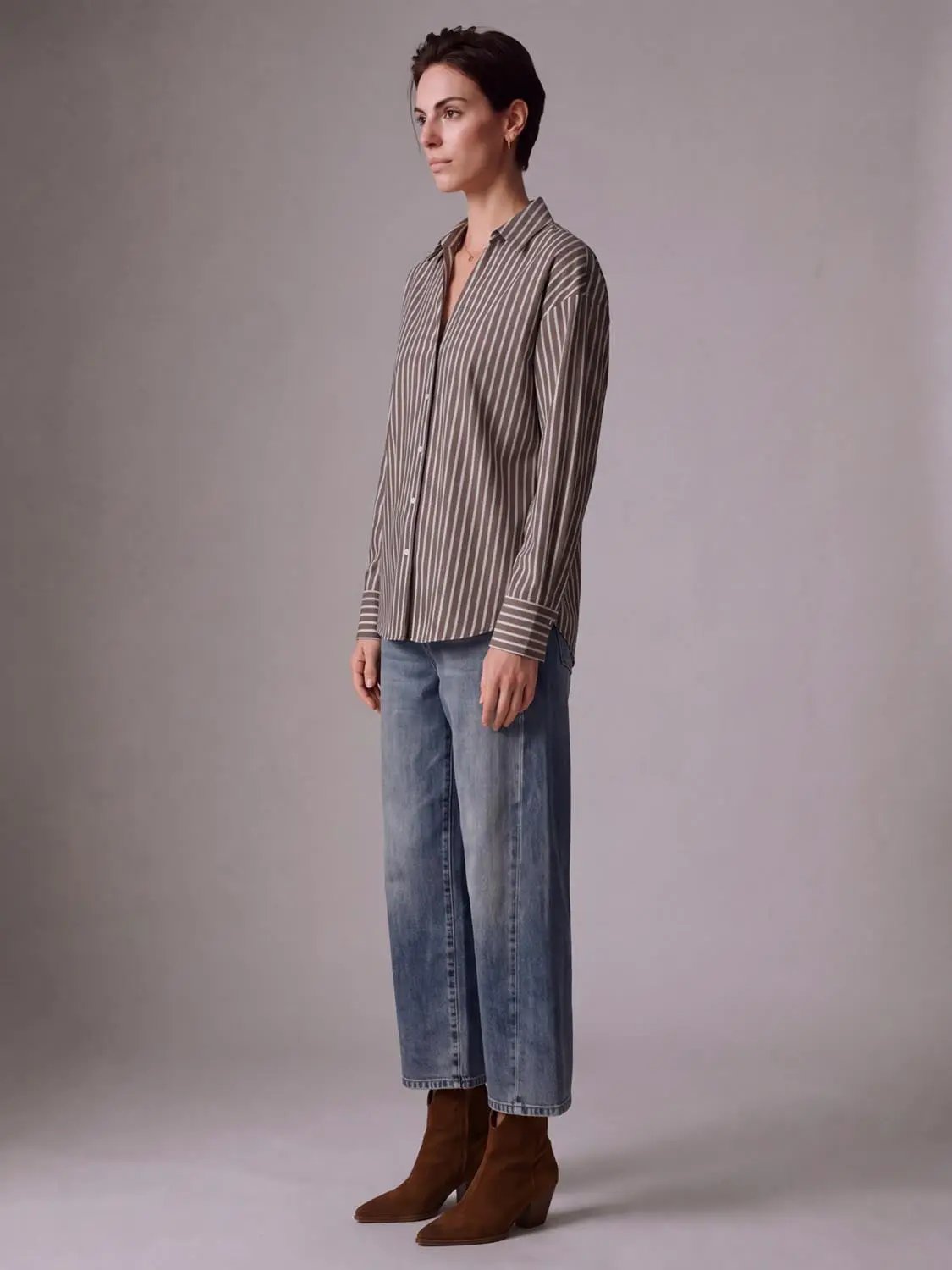 Striped button-up shirt for women in taupe and white vertical stripes.
