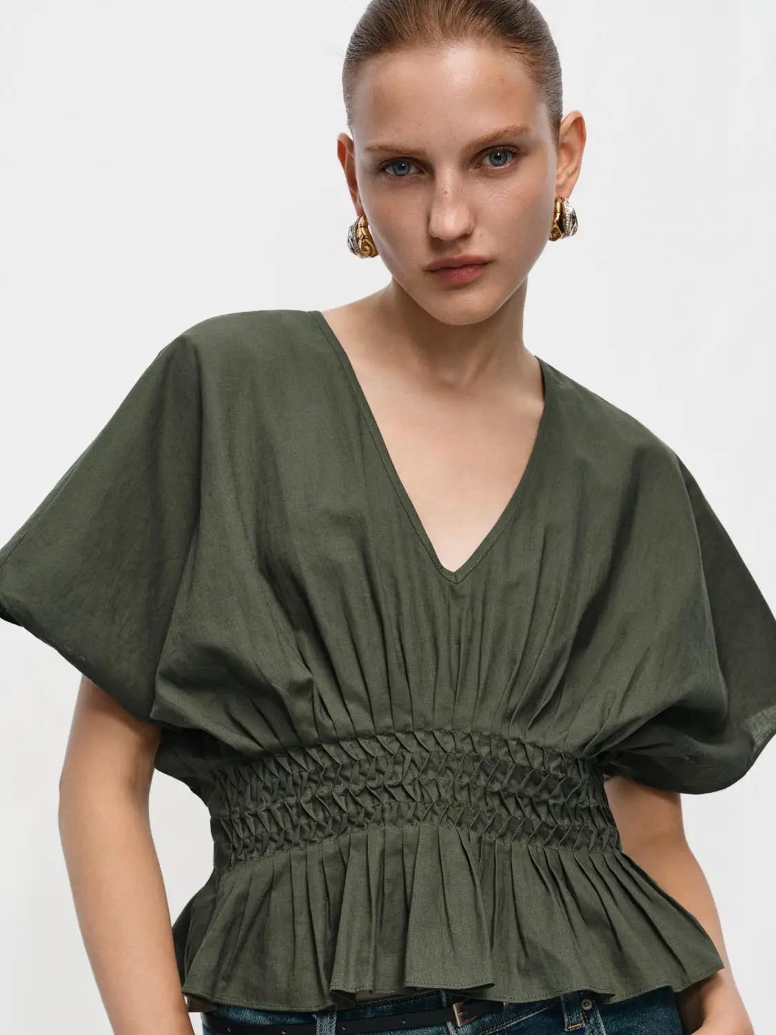 V-neck puff-sleeve smocked-waist cotton-linen blouse in olive green by Urban Revivo Fashion