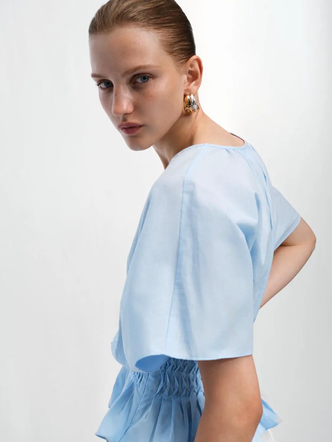 Light blue V-neck puff-sleeve smocked-waist cotton-linen-blend blouse