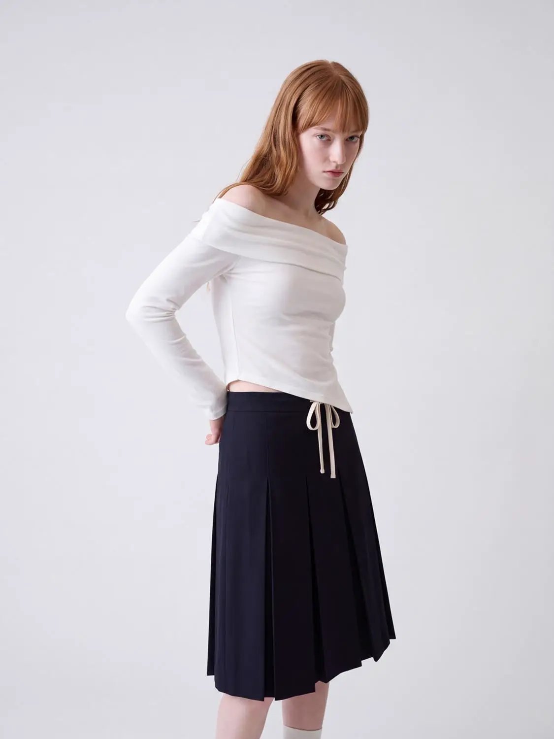 Off-shoulder white long-sleeve T-shirt and navy pleated midi skirt, Urban Revivo Fashion
