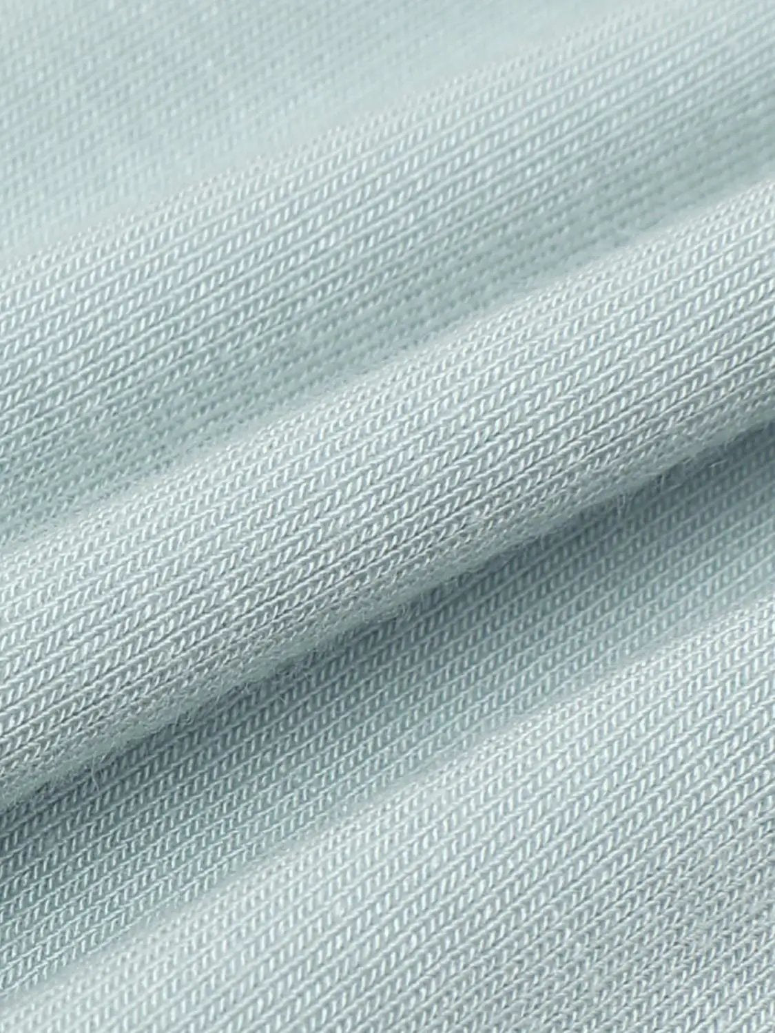 Draped short sleeve ruched-waist T-shirt fabric close-up in light blue