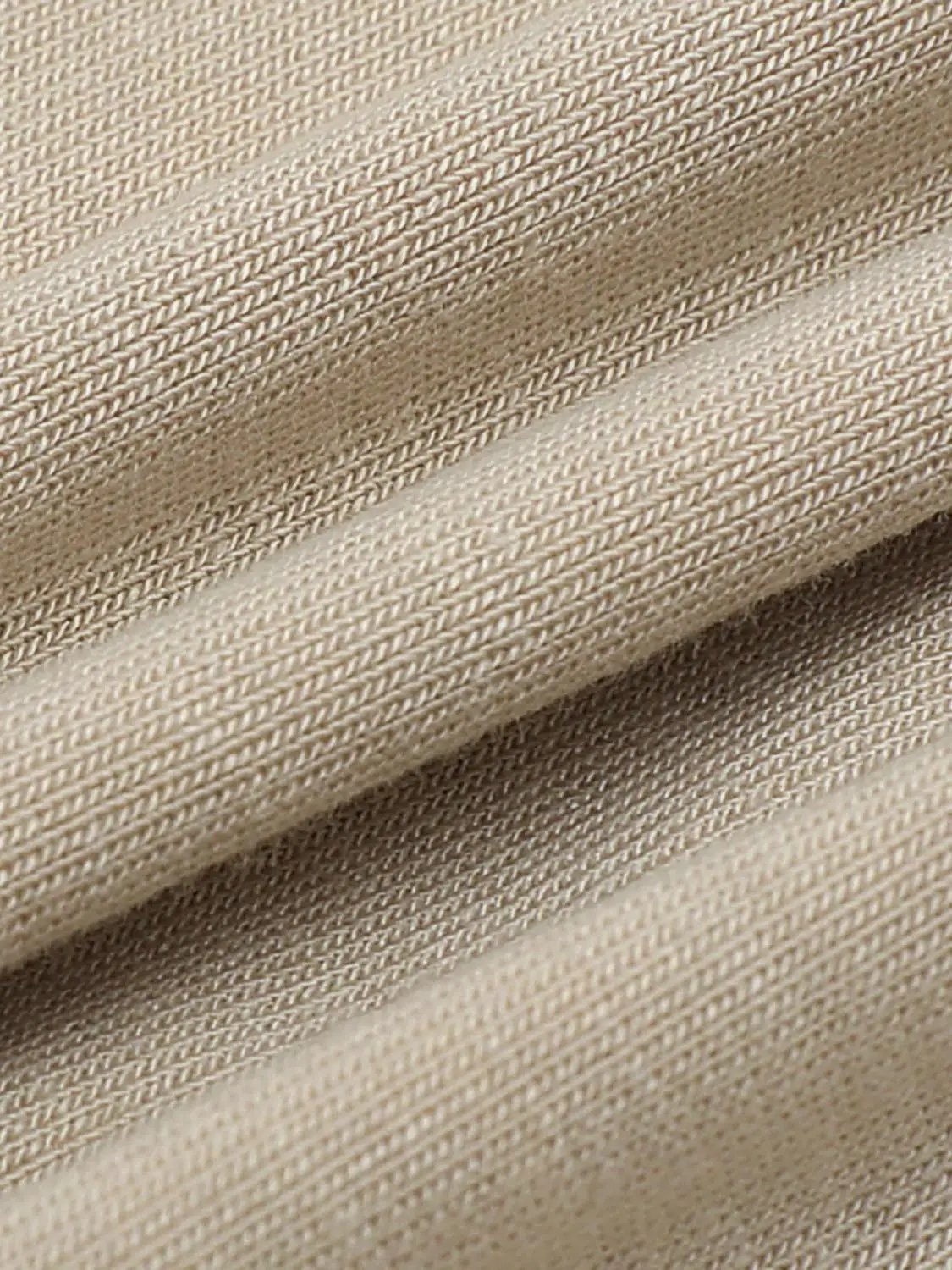 Draped Short Sleeve Ruched Waist T-shirt beige knit fabric close-up