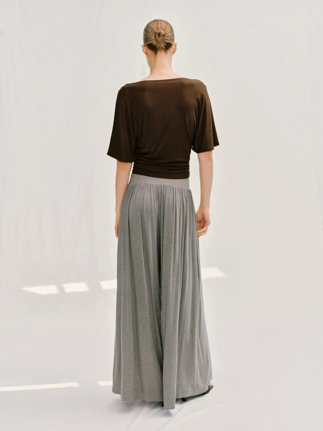 Draped Short Sleeve Ruched Waist T-shirt, brown, paired with gray wide-leg skirt as a two-piece outfit.