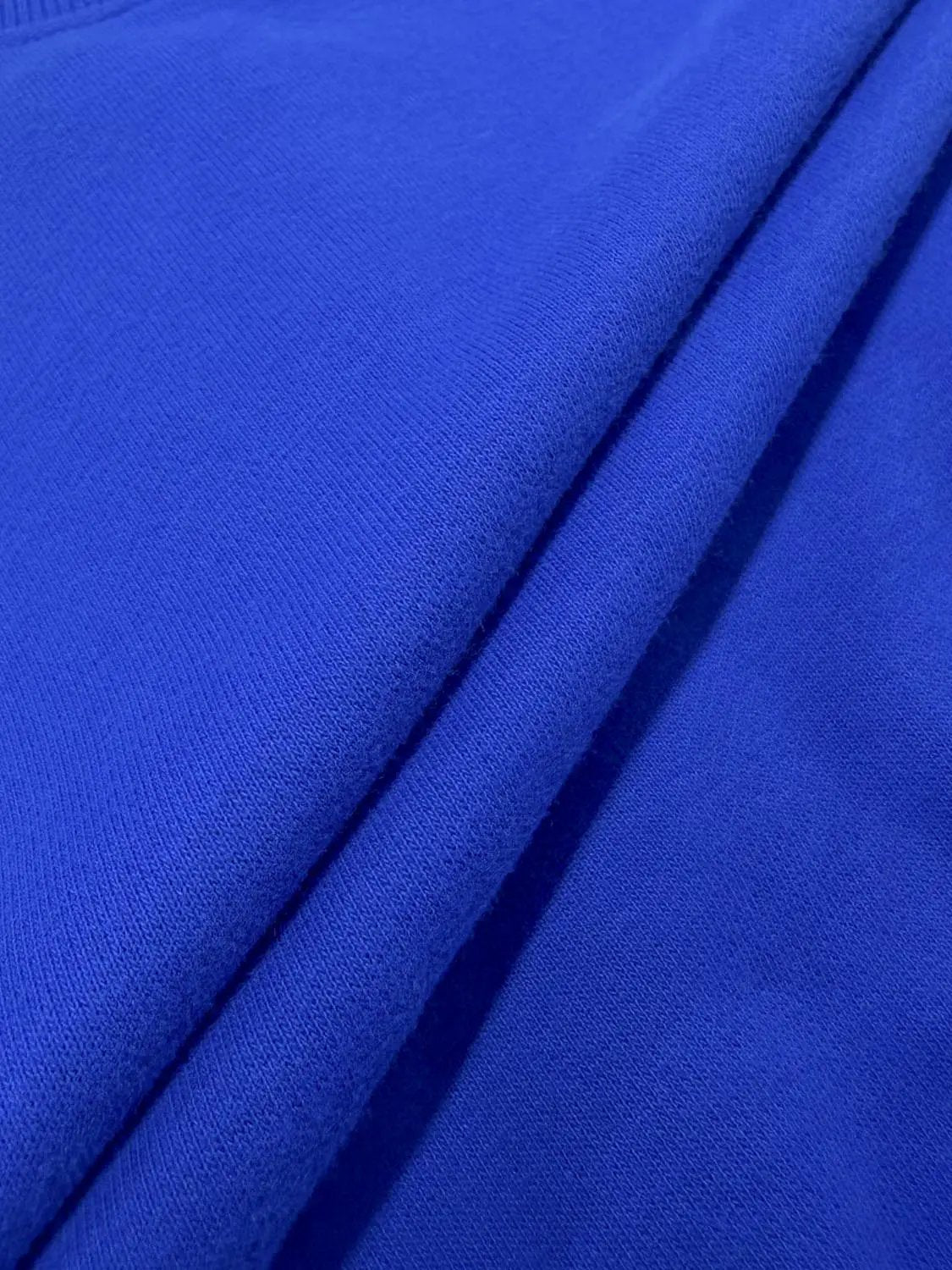 Sweatshirt royal blue knit fabric with seam detail.