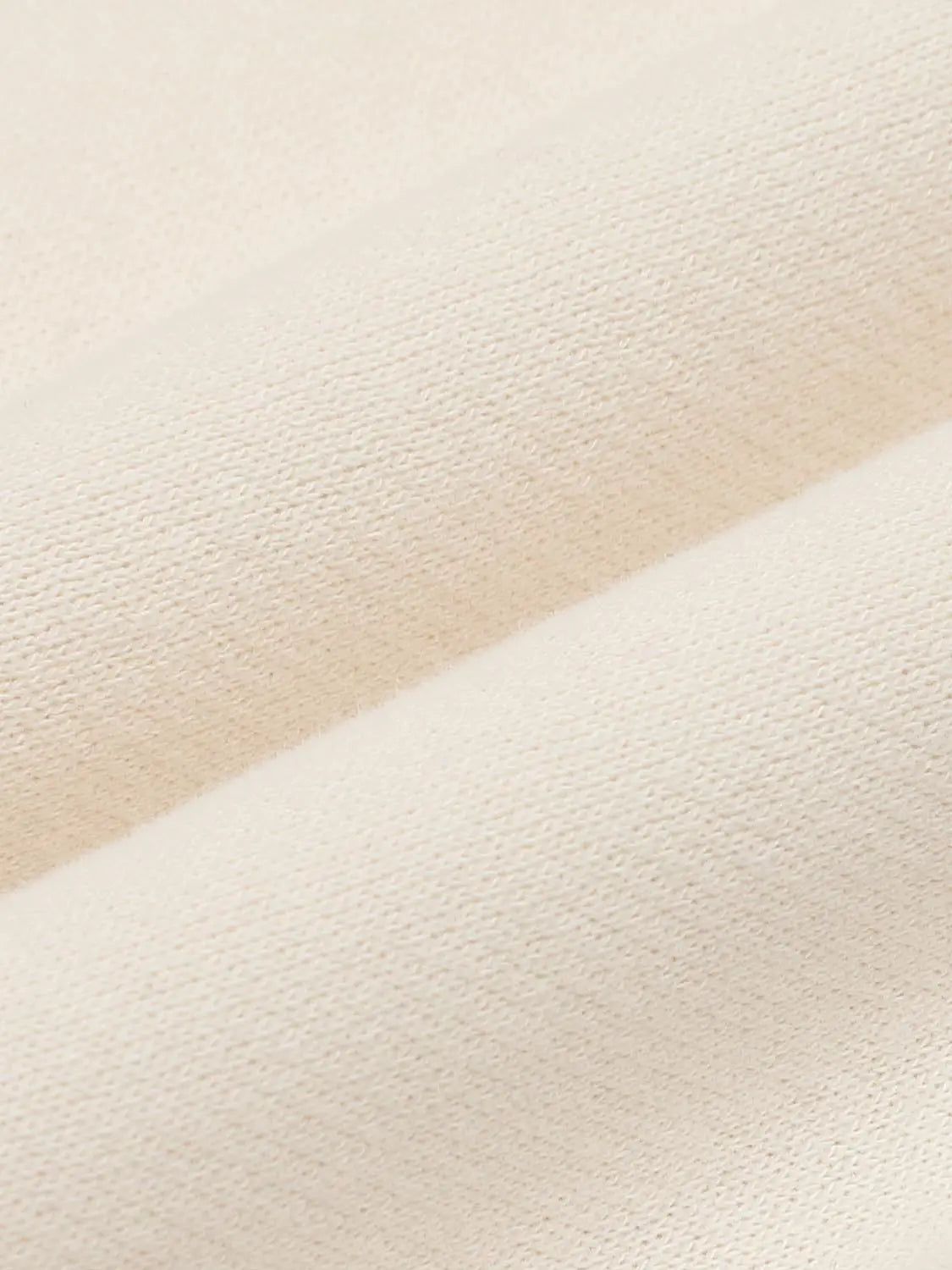 Sweatshirt beige knit fabric close-up texture
