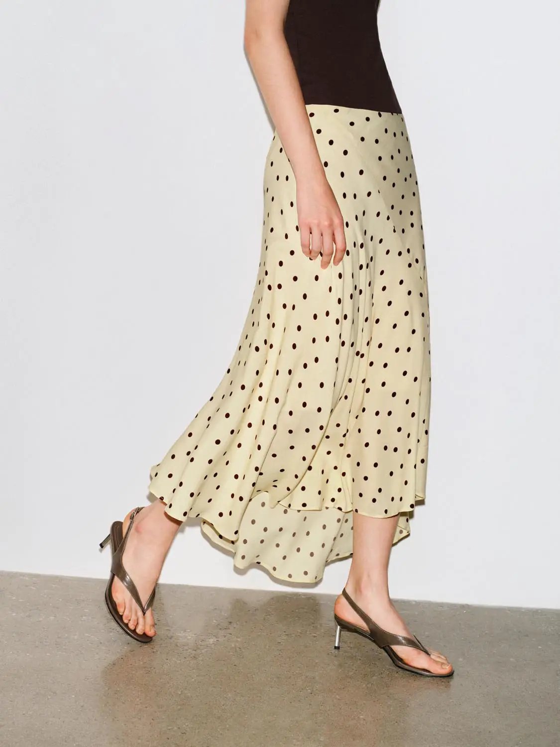 Polka dot maxi wrap skirt in cream with brown spots; asymmetric hem by Urban Revivo