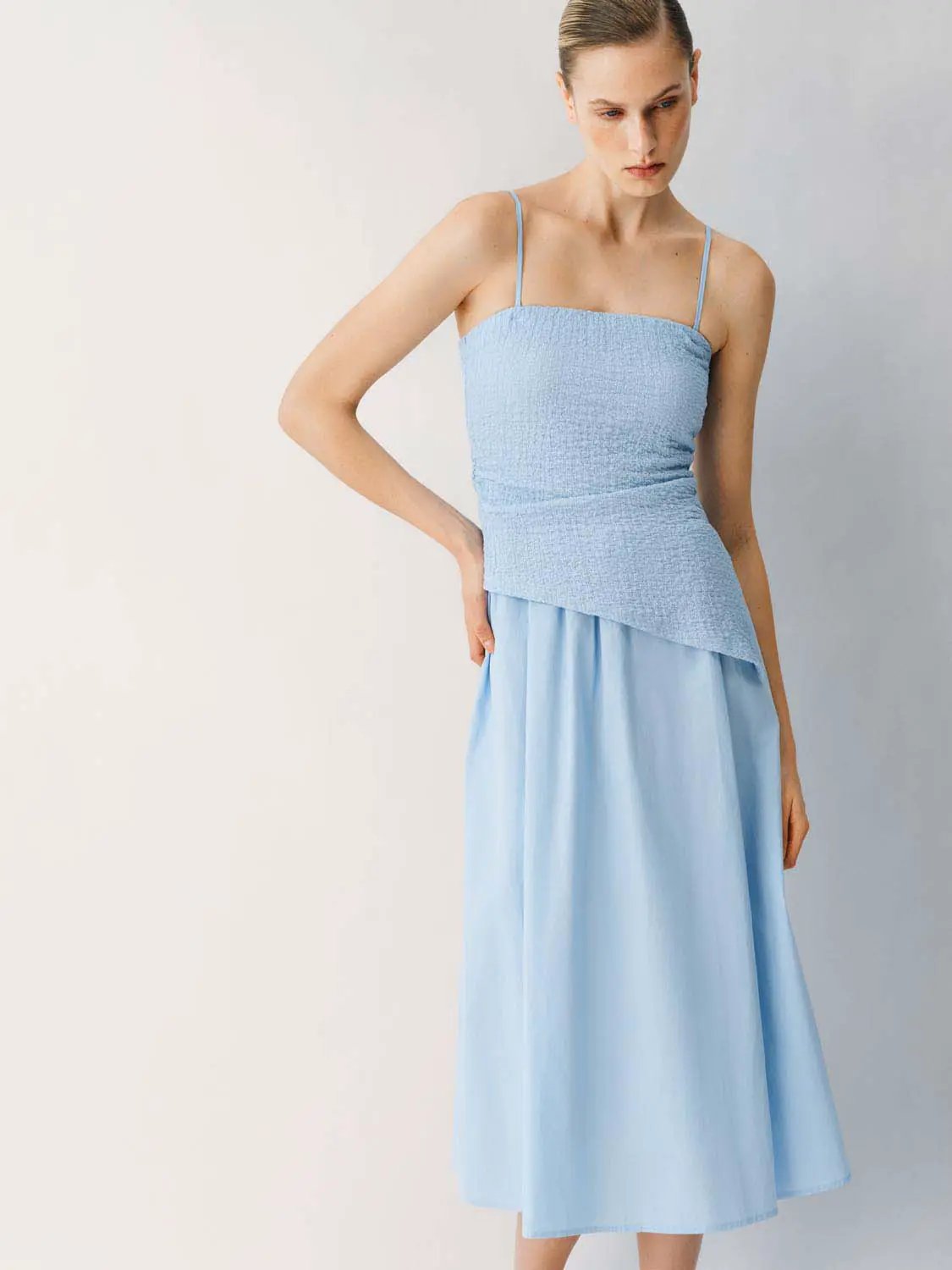 Thin Stretch Fabric Strappy A-Line Midi Dress in light blue with a smocked bodice and flowing skirt