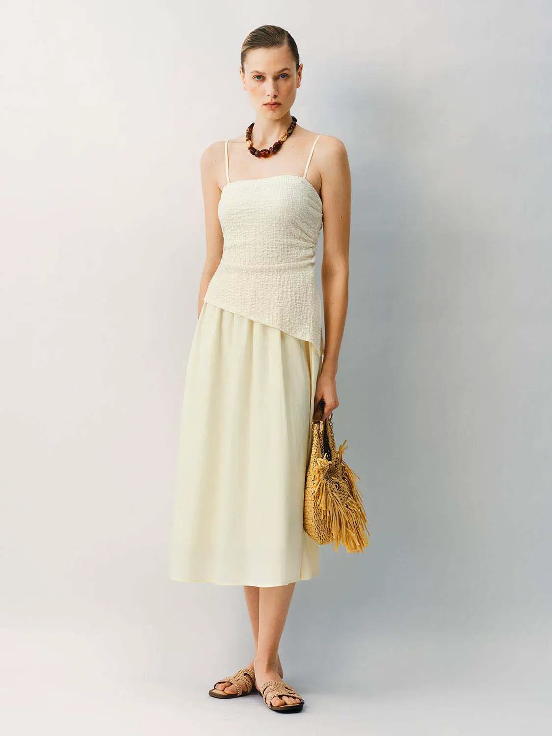 A-line midi dress with thin straps in cream stretch fabric