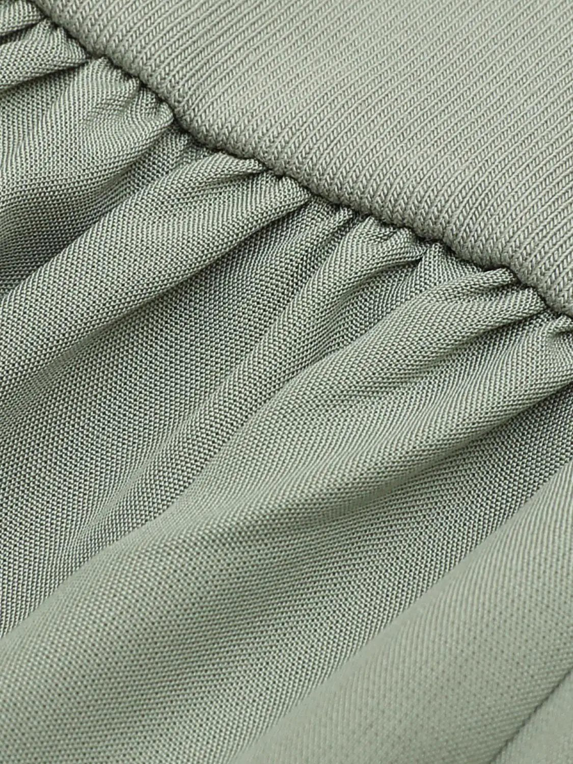 Dress, A-Line style, gray-green twill fabric with pleated waist details