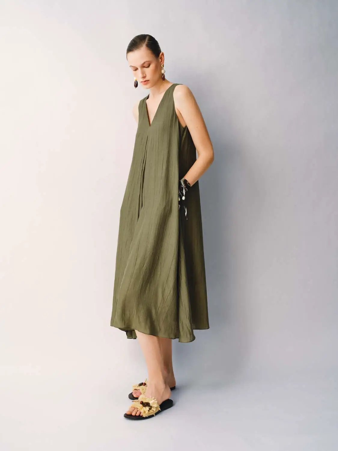 Slight Stretch A-Line Dress in olive green with sleeveless V-neck and lightweight fabric