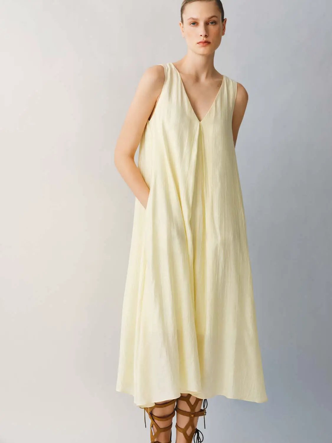 Slight Stretch A-Line Dress, sleeveless pale yellow with V-neck and flowing fabric