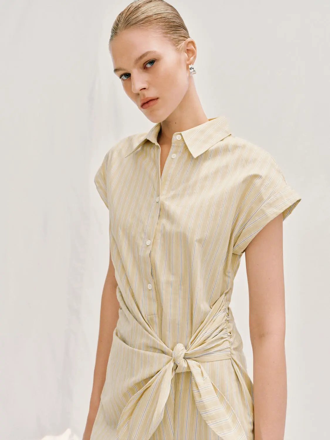 A-Line Dress in beige striped fabric with front buttons and waist tie, Urban Revivo Fashion.