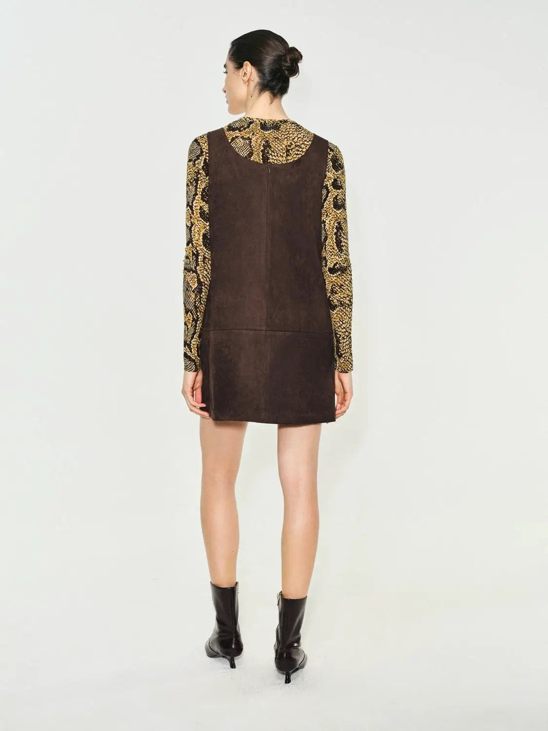 Panelled brown suede A-line sleeveless mini dress; back view on model.