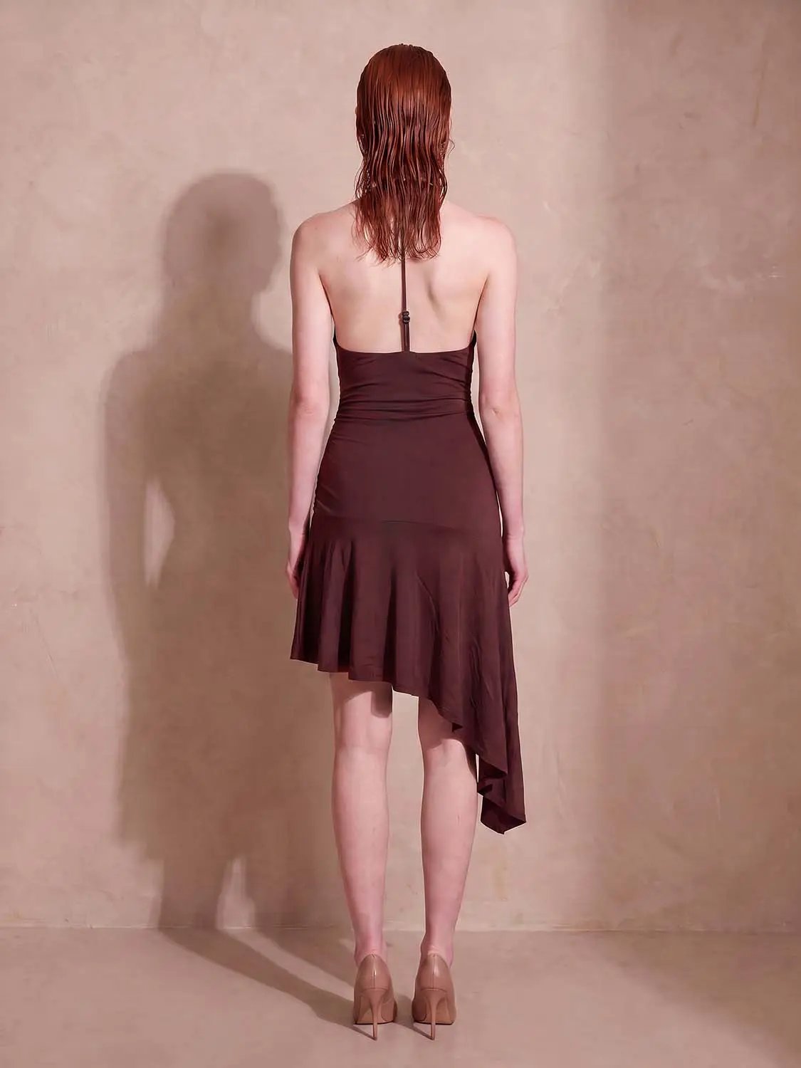 A-Line Dress in burgundy with asymmetric ruffle hem, back view