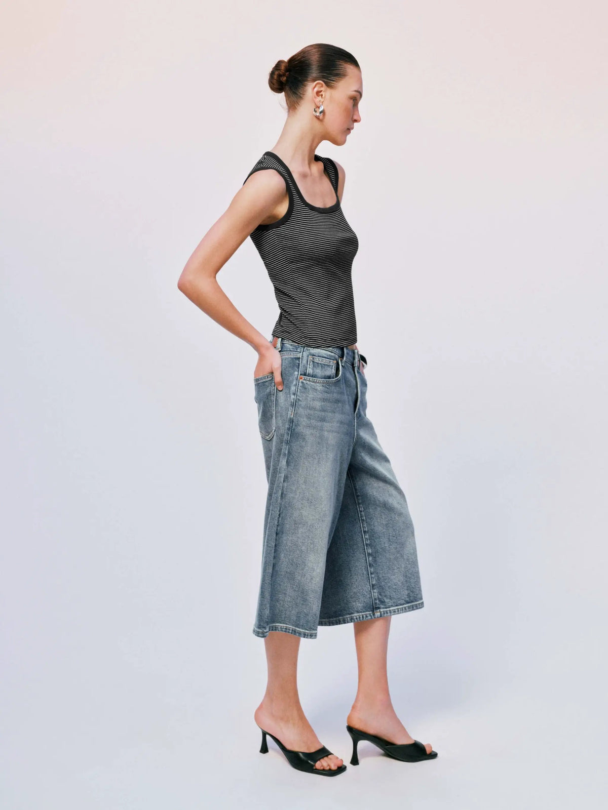 Washed Cropped Cotton Wide-Leg Jeans in blue denim with a relaxed cropped silhouette.
