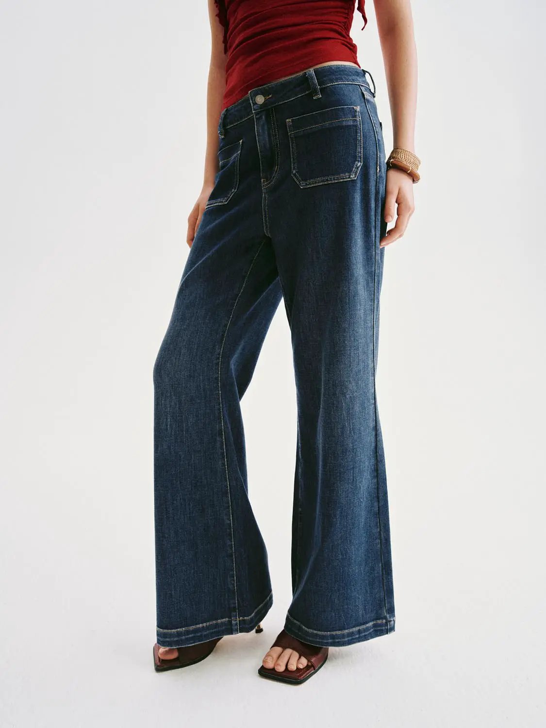 High-waisted patch-pocket wide-leg jeans in dark blue denim.